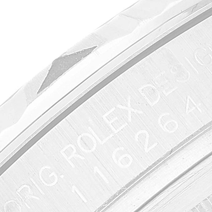 The image shows a close-up of the bezel and an engraved inscription on the Rolex Turn-o-Graph 116264 Men
s Stainless Steel Blue Dial 116264 Men
s Stainless Steel Blue Dial watch.