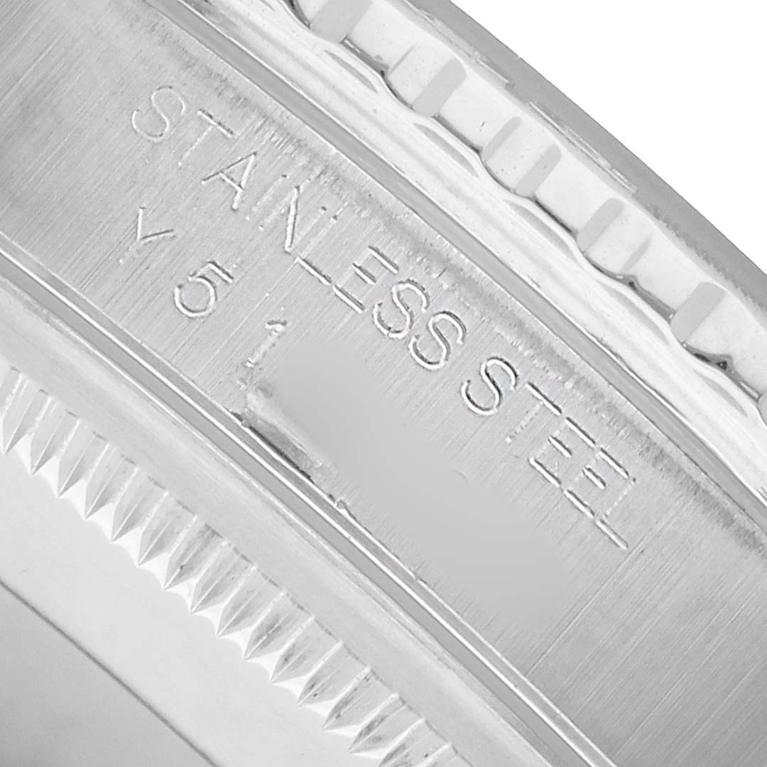 The image shows a close-up of the stainless steel case and bezel edge of a Rolex Turn-o-Graph 16264 Men's Stainless Steel Black Dial watch.