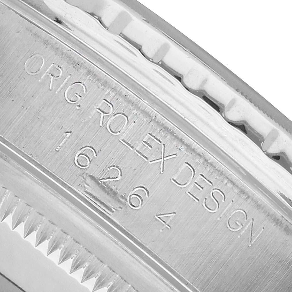 The image shows a close-up of the Rolex Turn-o-Graph 16264 Men's Stainless Steel Black Dial model, focusing on the engraved design number on its side.