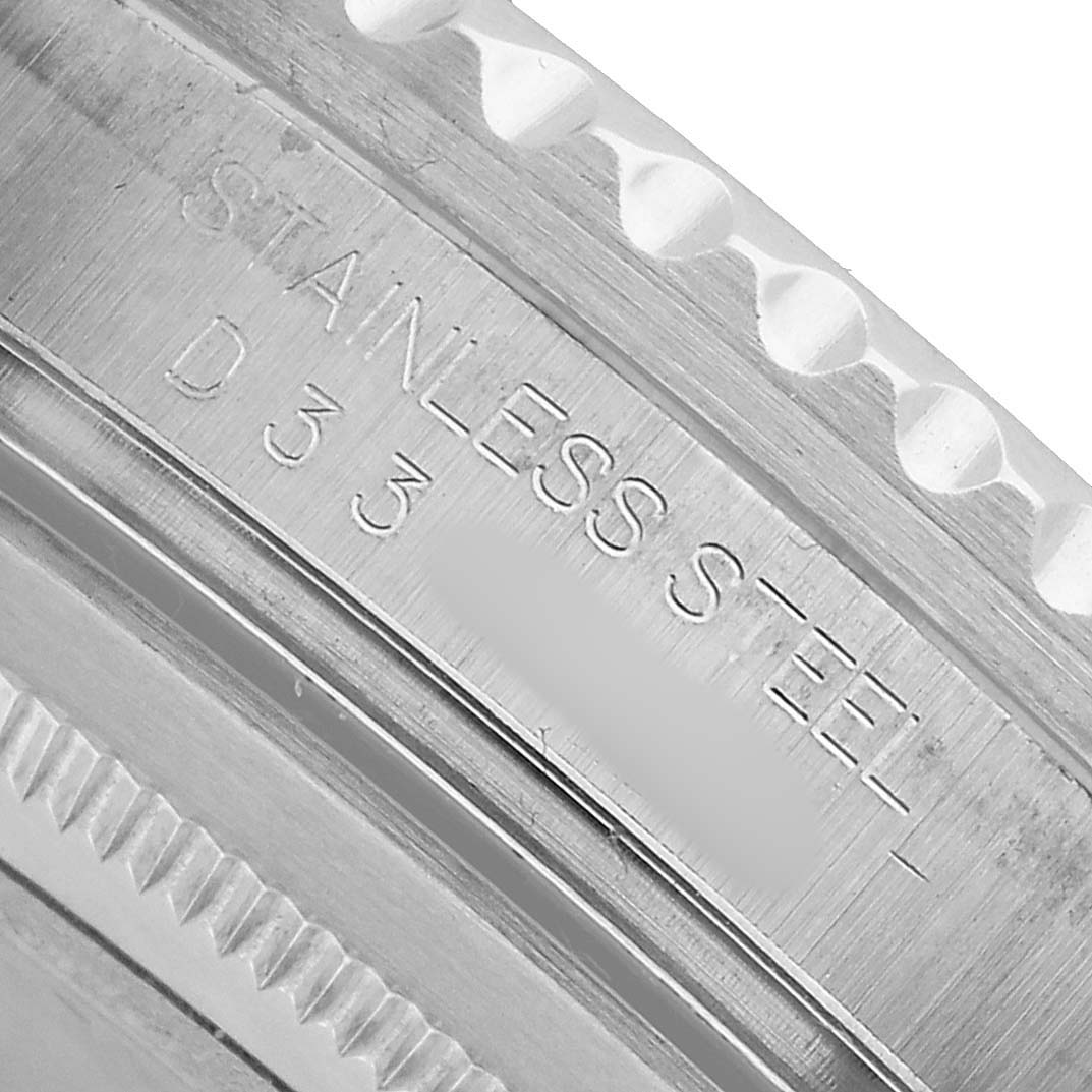 The image shows a close-up of the Rolex GMT-Master 16710 Men's Stainless Steel Black Dial's stainless steel case edge and bezel.