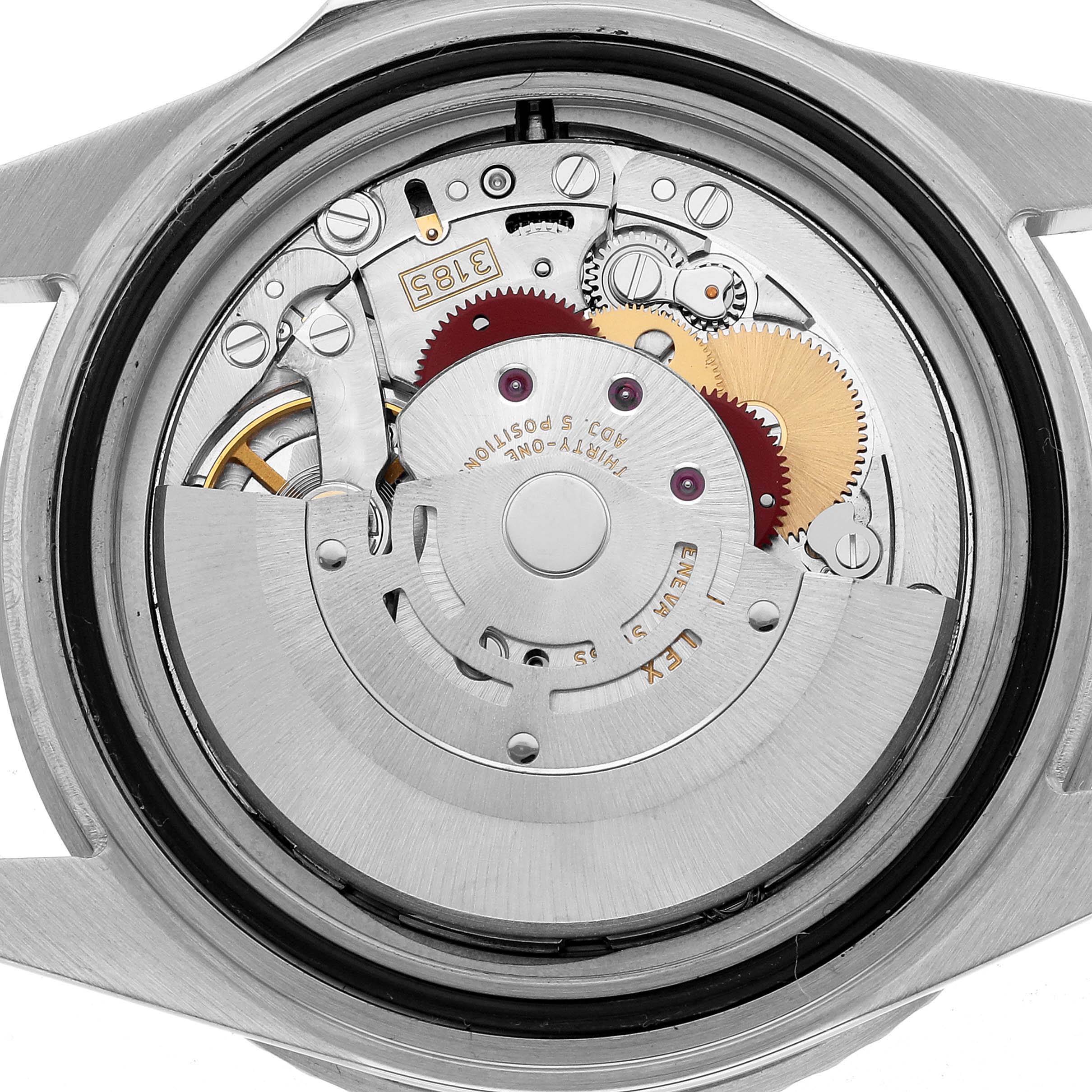 The image shows the internal mechanism of a Rolex GMT-Master 16710 Men's Stainless Steel Black Dial watch from the back angle, displaying gears and components.