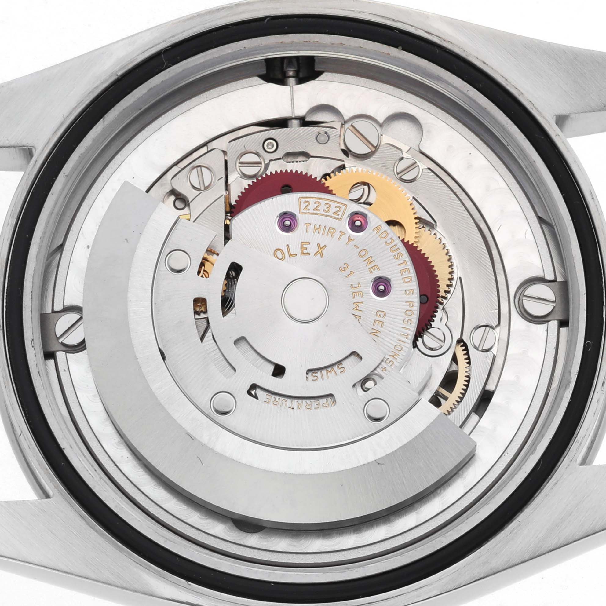 The image shows the back view of the Rolex Oyster Perpetual 124200 Men's Stainless Steel Black Dial, revealing its intricate automatic movement components.