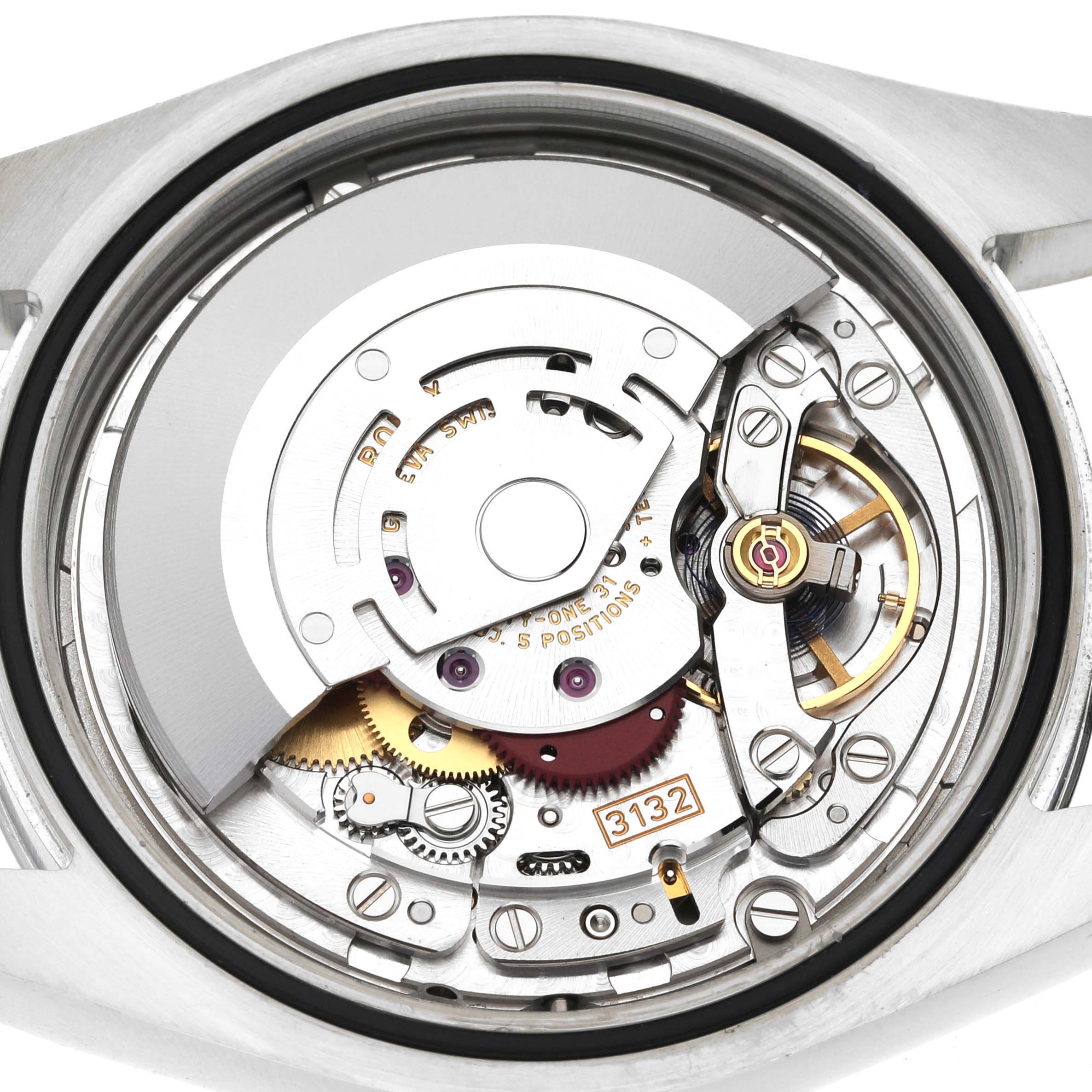 The image shows the internal mechanism of a Rolex Oyster Perpetual 114300 Men's Stainless Steel Blue Dial 114300 Men's Stainless Steel Blue Dial watch from a rear angle, highlighting its movement components.