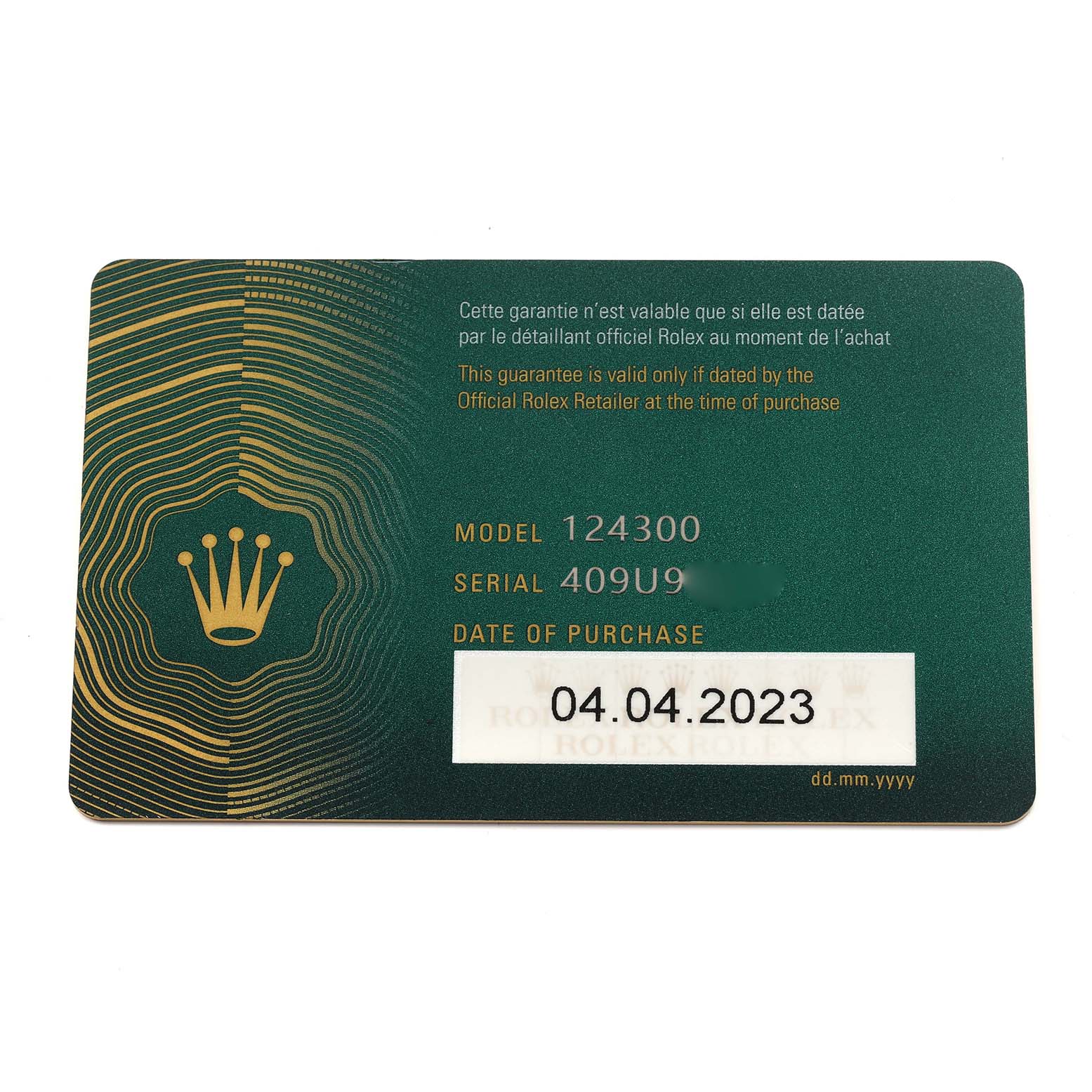 The image shows a Rolex Oyster Perpetual 124300 Men
s Stainless Steel Black Dial 124300 Men
s Stainless Steel Black Dial warranty card displaying model and serial numbers.