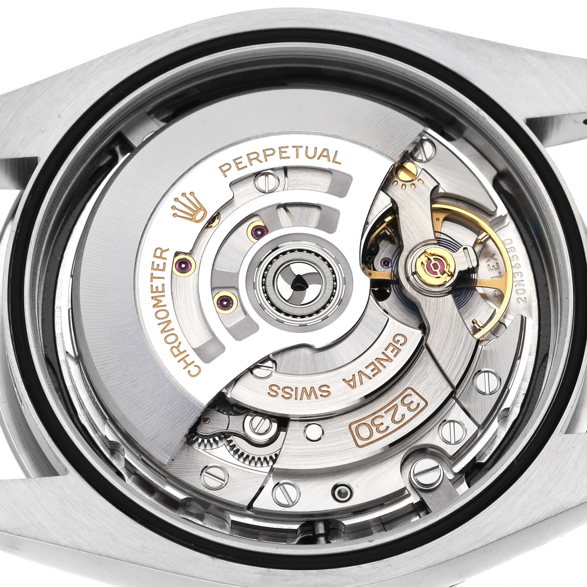 The image shows the movement mechanism of the Rolex Oyster Perpetual 124300 Men
s Stainless Steel Black Dial 124300 Men
s Stainless Steel Black Dial watch from a top-down angle.