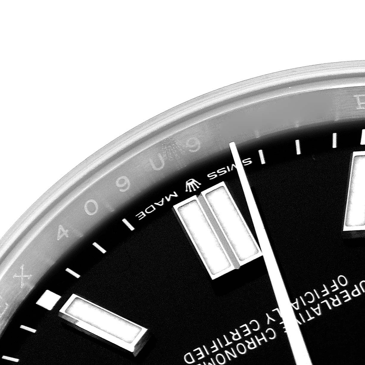 The image shows a close-up of the dial and hour markers of the Rolex Oyster Perpetual 124300 Men
s Stainless Steel Black Dial 124300 Men
s Stainless Steel Black Dial, highlighting "Swiss Made" text.