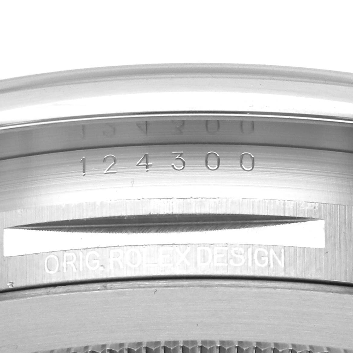 The image shows the side of a Rolex Oyster Perpetual 124300 Men
s Stainless Steel Black Dial 124300 Men
s Stainless Steel Black Dial, focusing on the engraved model number.