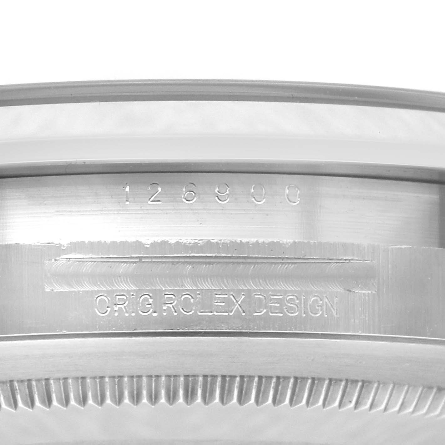 The image shows a close-up of the case side engraving on a Rolex Air-King 126900 Men's Stainless Steel Black Dial 126900 Men's Stainless Steel Black Dial, displaying the model number and text "ORIG ROLEX DESIGN."