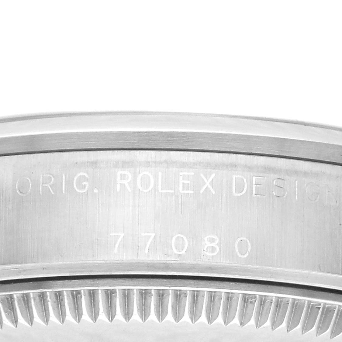 This image shows the side of a Rolex Mid-Size 77080 Women's Stainless Steel Pink Dial 77080 Women's Stainless Steel Pink Dial watch, featuring its engraved design details.