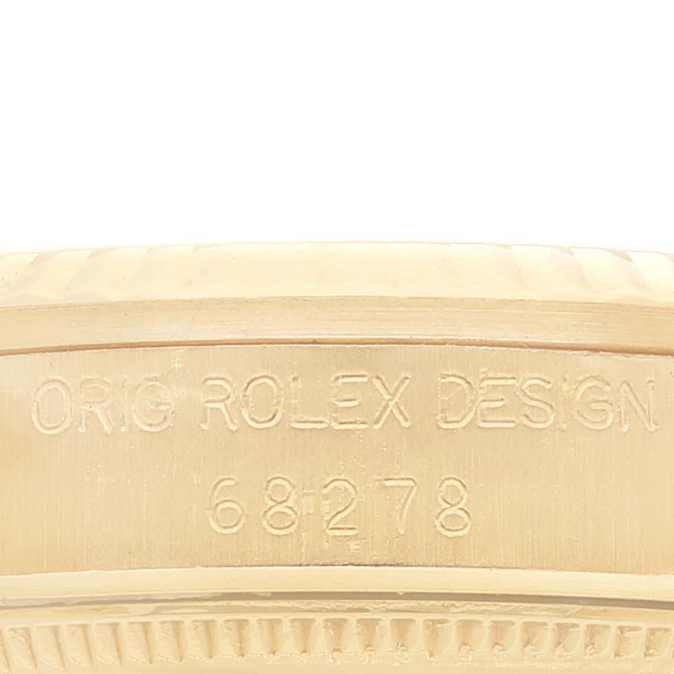This image shows a close-up of the case side of a Rolex President 68278 Women
s Yellow Gold White Dial 68278 Women
s Yellow Gold White Dial model watch, featuring its model number and design engraving.