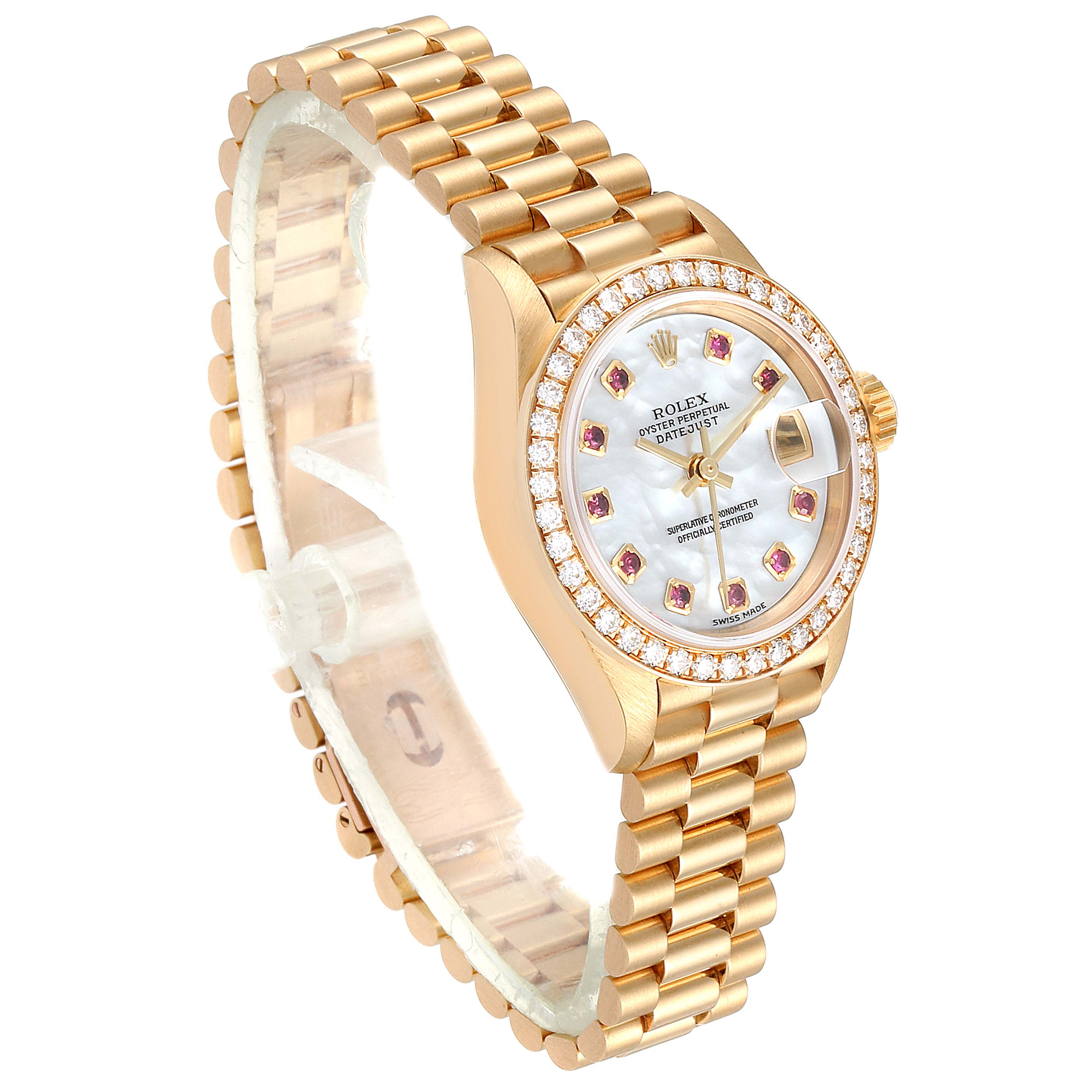 The Rolex President 79138 Women
s Yellow Gold Mother of Pearl Dial 79138 Women
s Yellow Gold Mother of Pearl Dial watch is shown at a three-quarter angle, displaying its gold bracelet, bejeweled bezel, and dial.