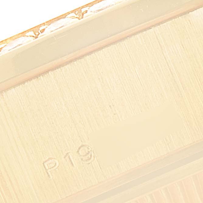 The image shows a close-up view of a part of a Rolex President 79138 Women
s Yellow Gold Mother of Pearl Dial 79138 Women
s Yellow Gold Mother of Pearl Dial model watch, highlighting the engraved serial or reference number.
