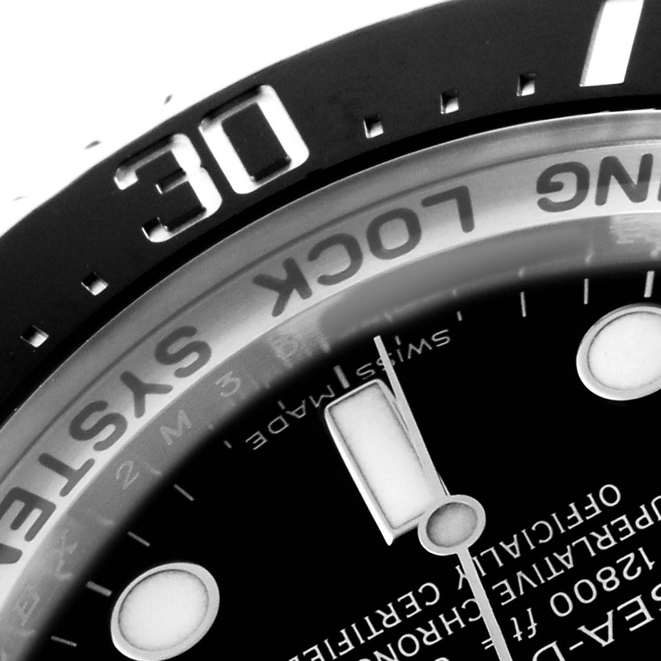 The image shows a close-up of the Rolex Sea-Dweller 116660 Men's Stainless Steel Black Dial's bezel, dial partially visible, and inner ring, focusing on the "30" mark and text.