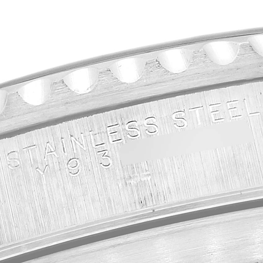 This close-up image shows the engraved markings on the case back of a Rolex Submariner 14060 Men
s Stainless Steel Black Dial 14060 Men
s Stainless Steel Black Dial watch.