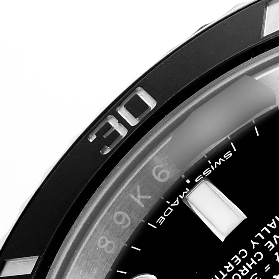 The image shows a close-up of the bezel and part of the dial of a Rolex Submariner 116610LN Men's Stainless Steel Black Dial.