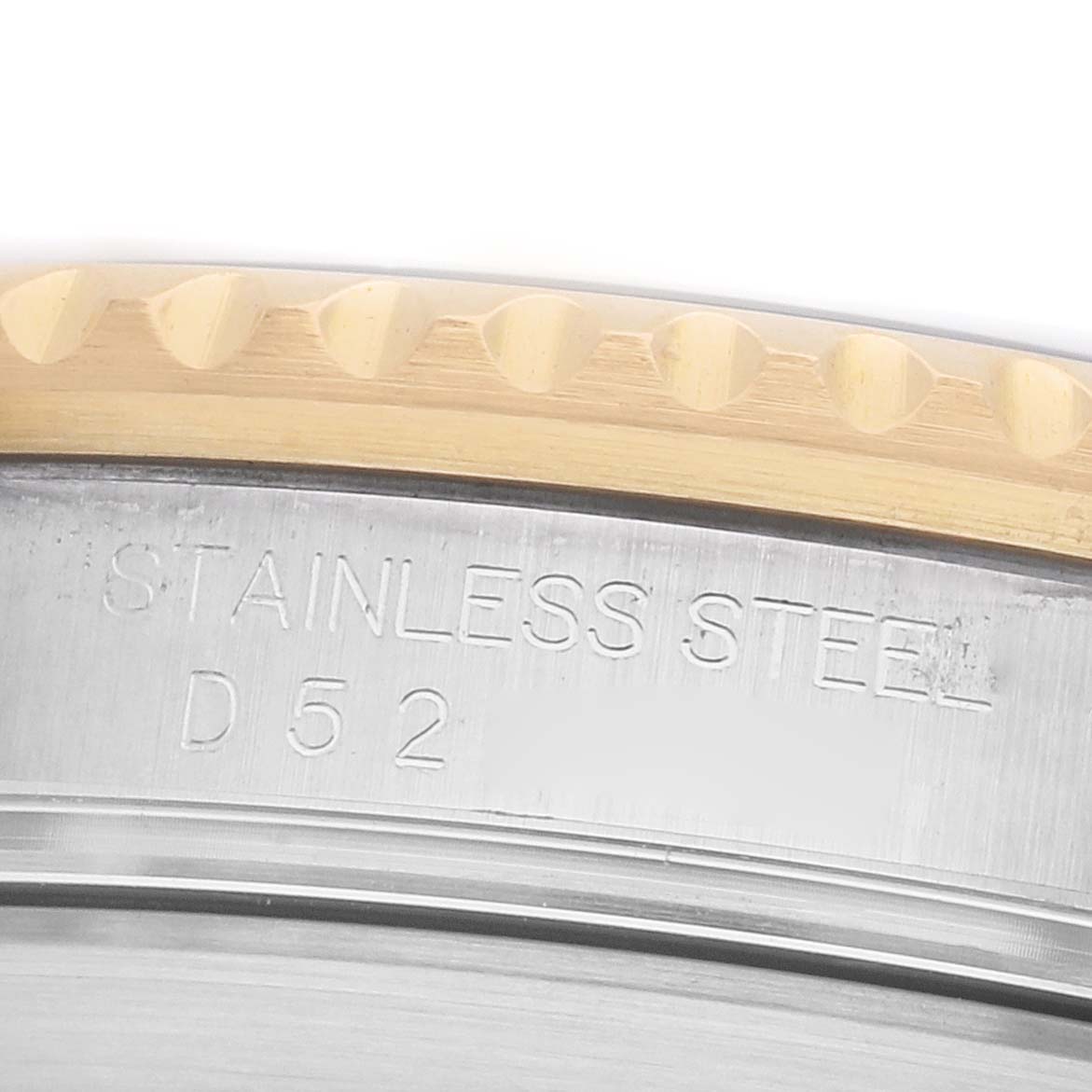 The image shows a close-up of the Rolex Submariner 16613 Men's Steel and Gold (two tone) Black Dial's case, highlighting the stainless steel and engraving details.