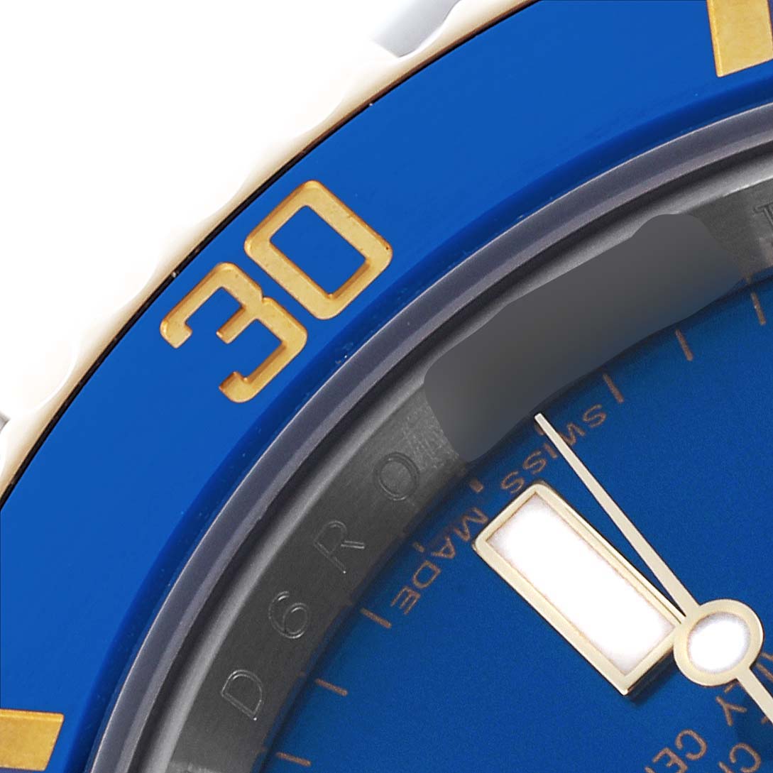 The image shows a close-up of a blue bezel and partial dial of a Rolex Submariner 116613LB Men's Steel and Gold (two tone) Blue Dial 116613LB Men's Steel and Gold (two tone) Blue Dial watch.
