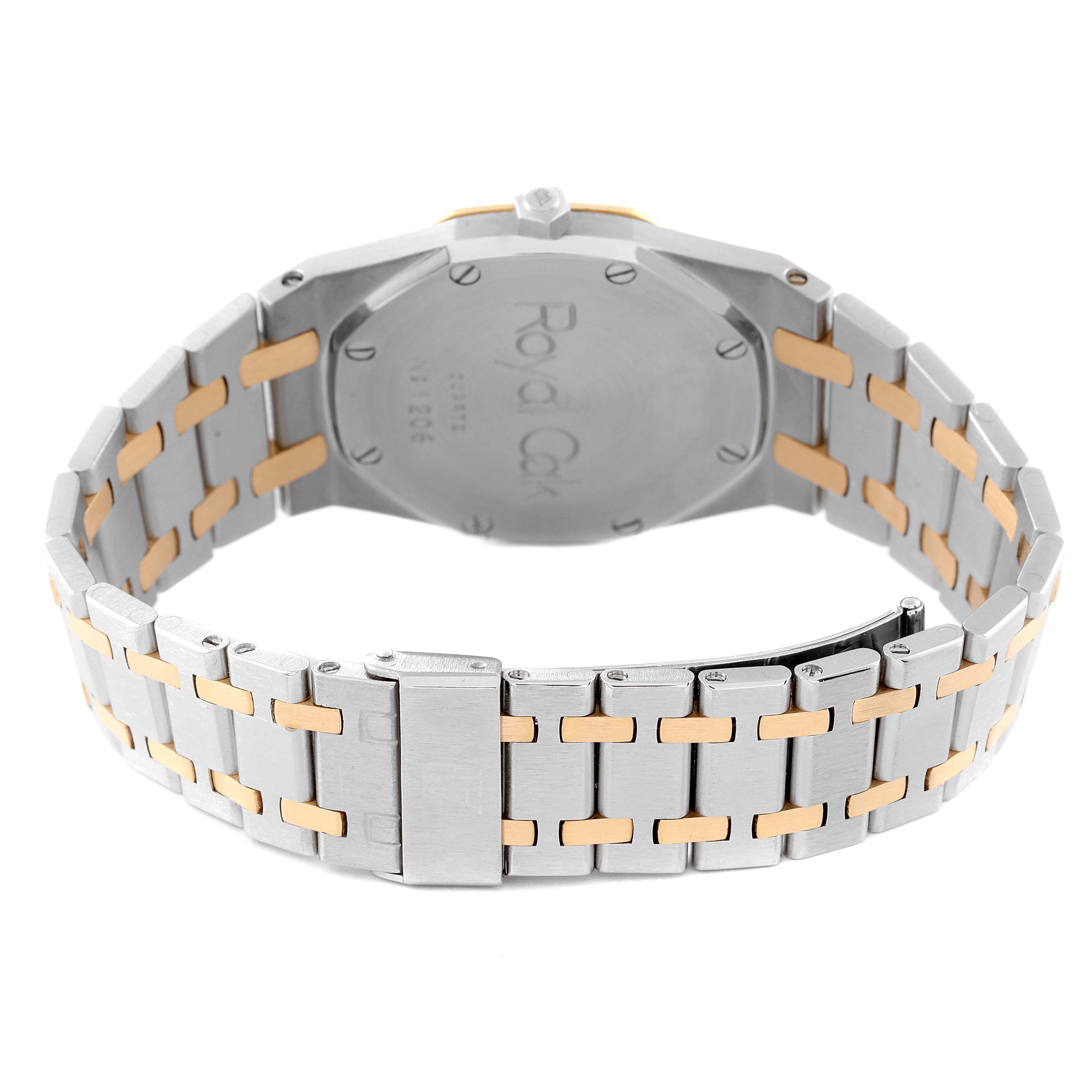 The image shows the back view of an Audemars Piguet Royal Oak 56303SA Men's Steel and Gold (two tone) Beige Dial 56303SA Men's Steel and Gold (two tone) Beige Dial watch, highlighting its two-tone metal bracelet and engraved case back.