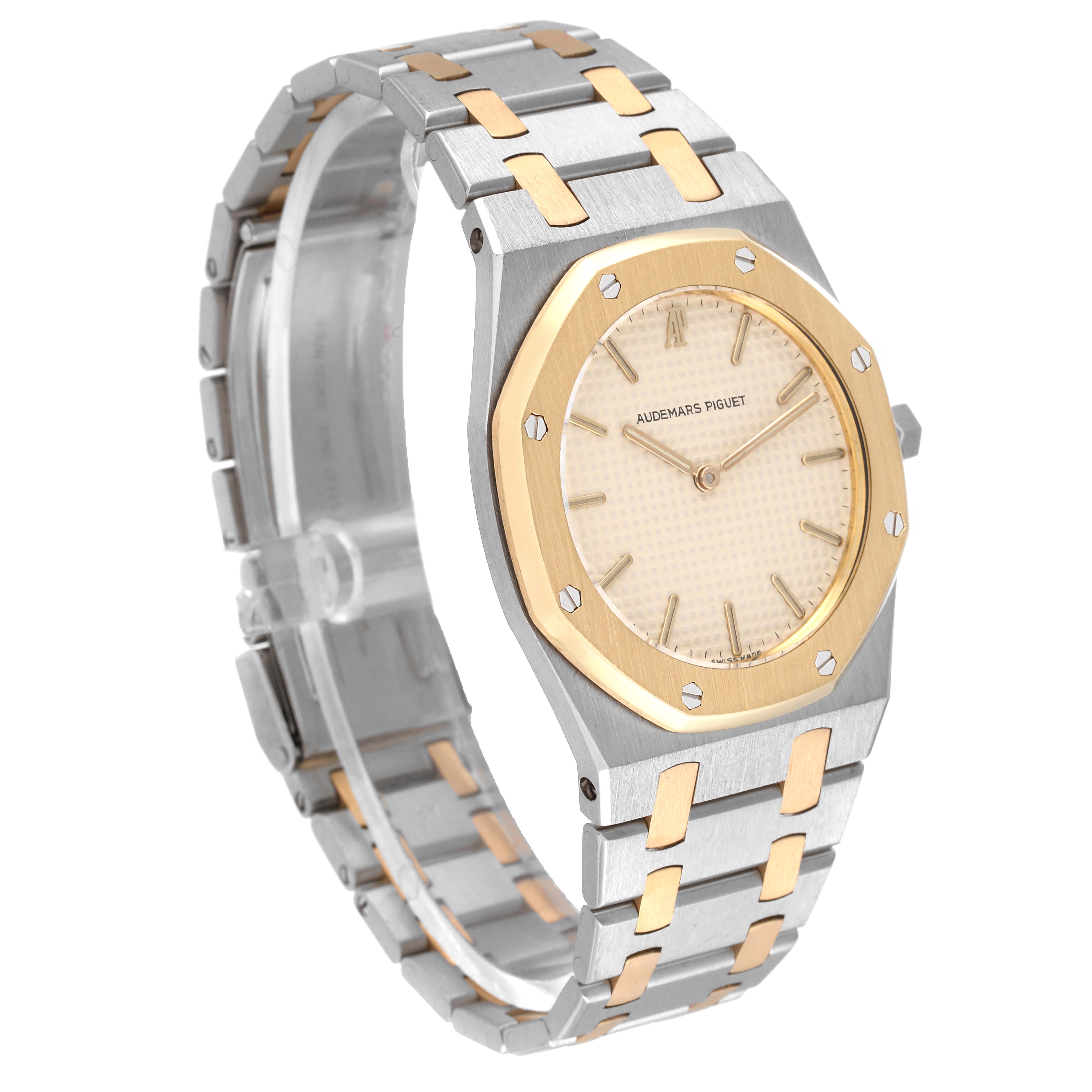 This image shows a side angle of the Audemars Piguet Royal Oak 56303SA Men's Steel and Gold (two tone) Beige Dial 56303SA Men's Steel and Gold (two tone) Beige Dial watch, highlighting its two-tone metal bracelet, case, and dial.