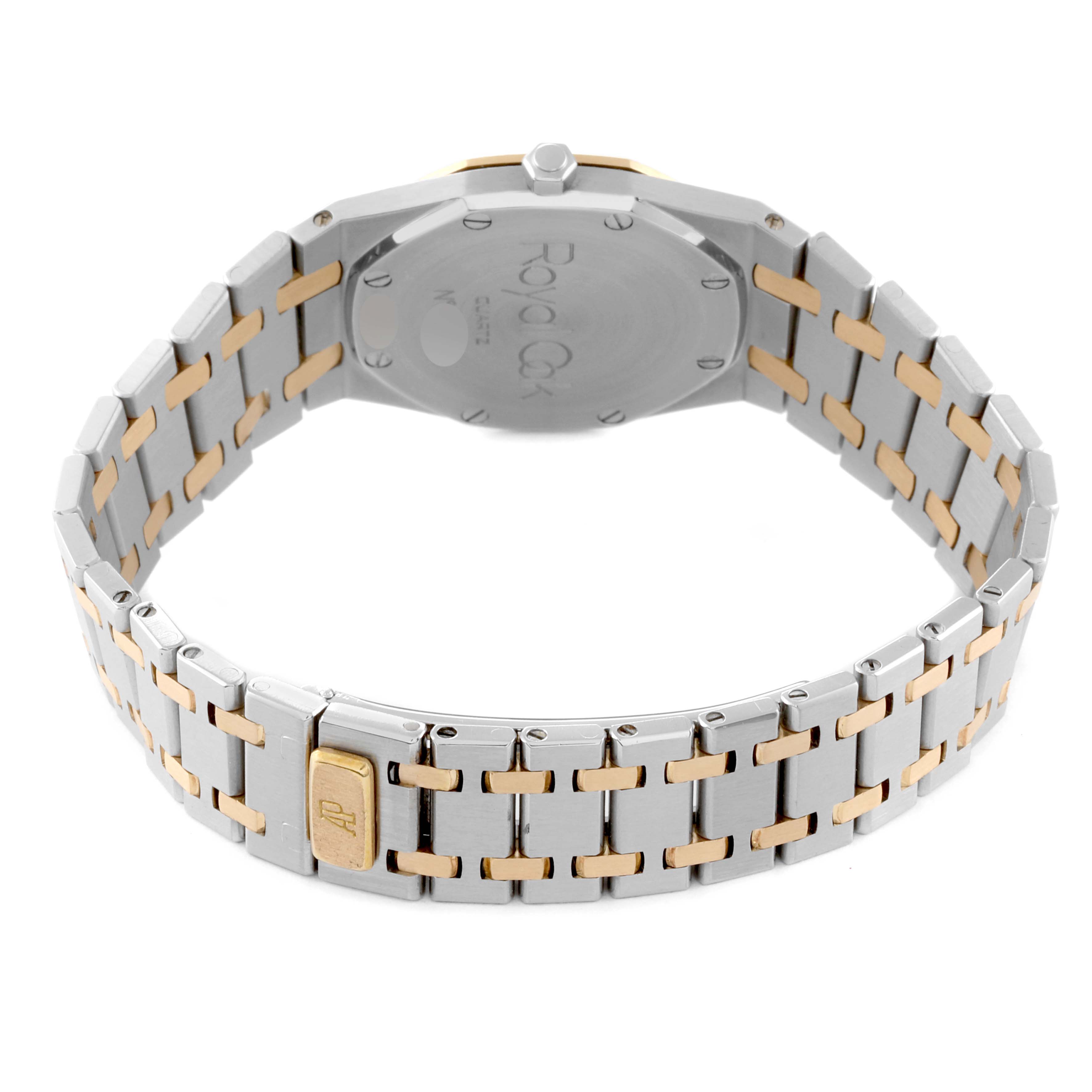 The image shows the back view of an Audemars Piguet Royal Oak 56303SA Men's Steel and Gold (two tone) Grey Dial 56303SA Men's Steel and Gold (two tone) Grey Dial watch, displaying its case back and two-tone metal bracelet.