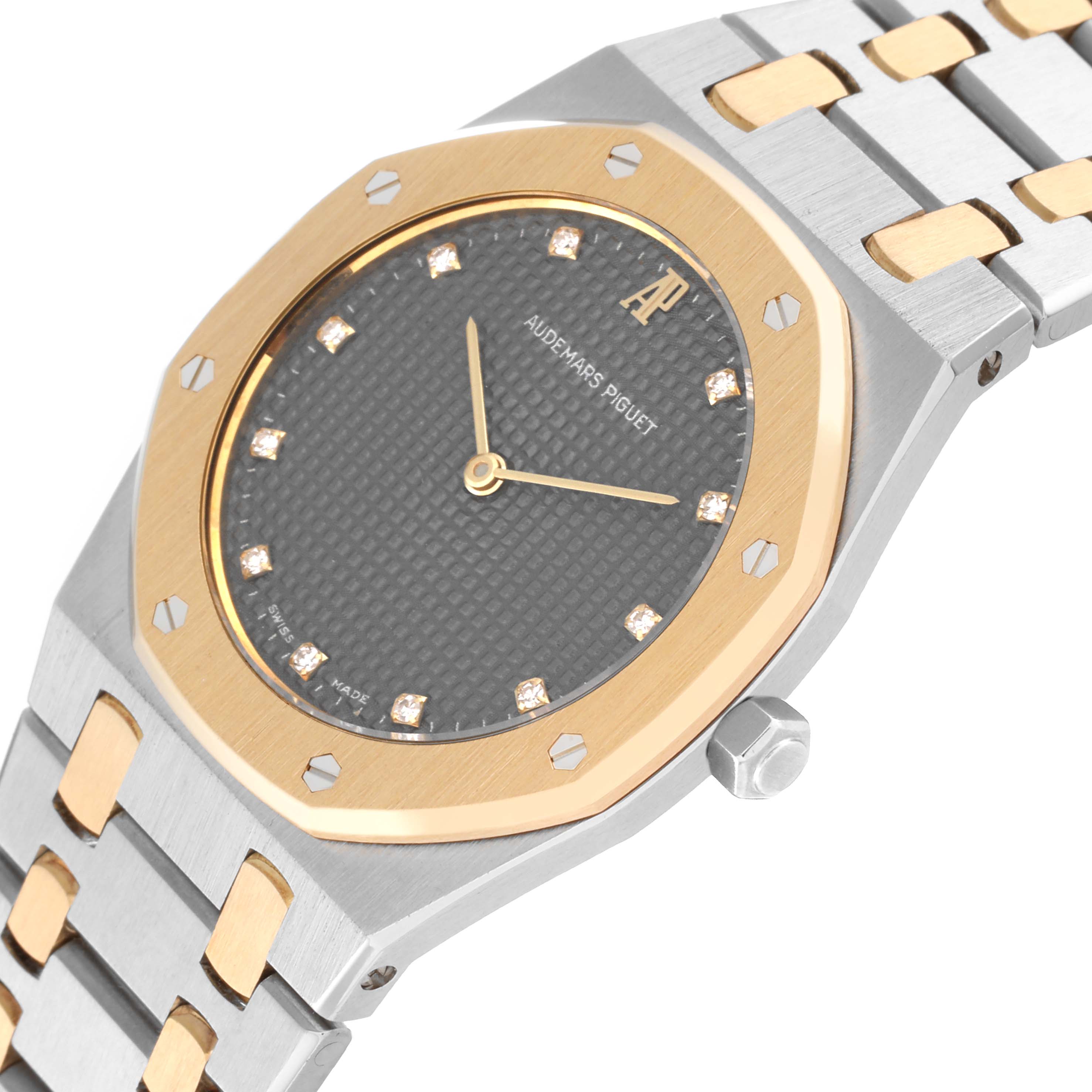 This image shows a close-up of the Audemars Piguet Royal Oak 56303SA Men's Steel and Gold (two tone) Grey Dial 56303SA Men's Steel and Gold (two tone) Grey Dial watch, highlighting the watch dial, bezel, and part of the bracelet.