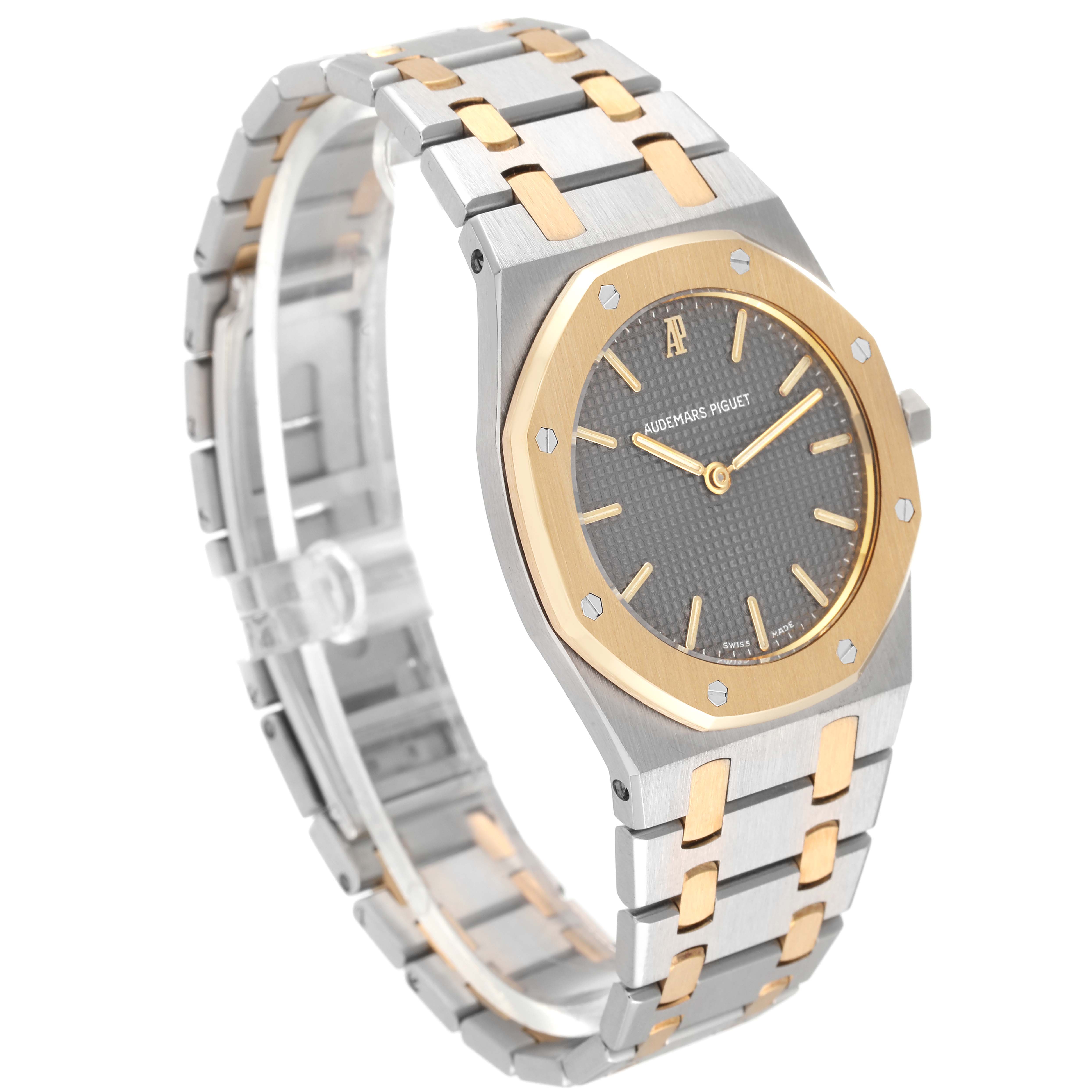 The image shows a side angle of the Audemars Piguet Royal Oak 56303SA Men's Steel and Gold (two tone) Grey Dial 56303SA Men's Steel and Gold (two tone) Grey Dial watch, highlighting its two-tone bracelet and distinct octagonal bezel.
