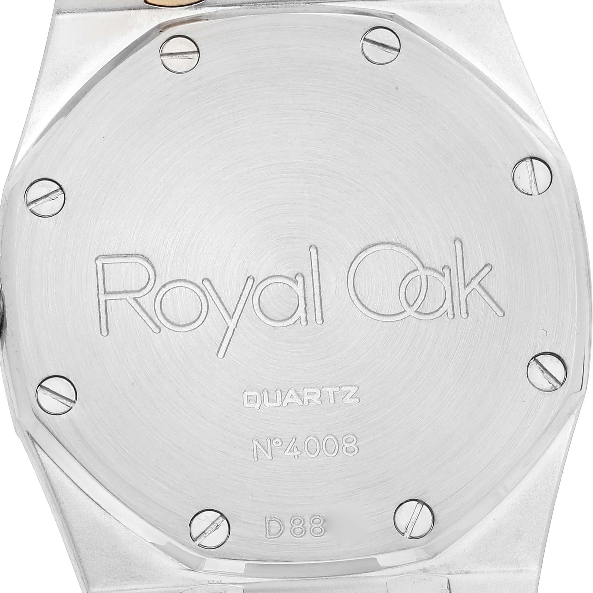 The image shows the back case of the Audemars Piguet Royal Oak 56303SA Men's Steel and Gold (two tone) Grey Dial 56303SA Men's Steel and Gold (two tone) Grey Dial watch, highlighting the model name and serial number.