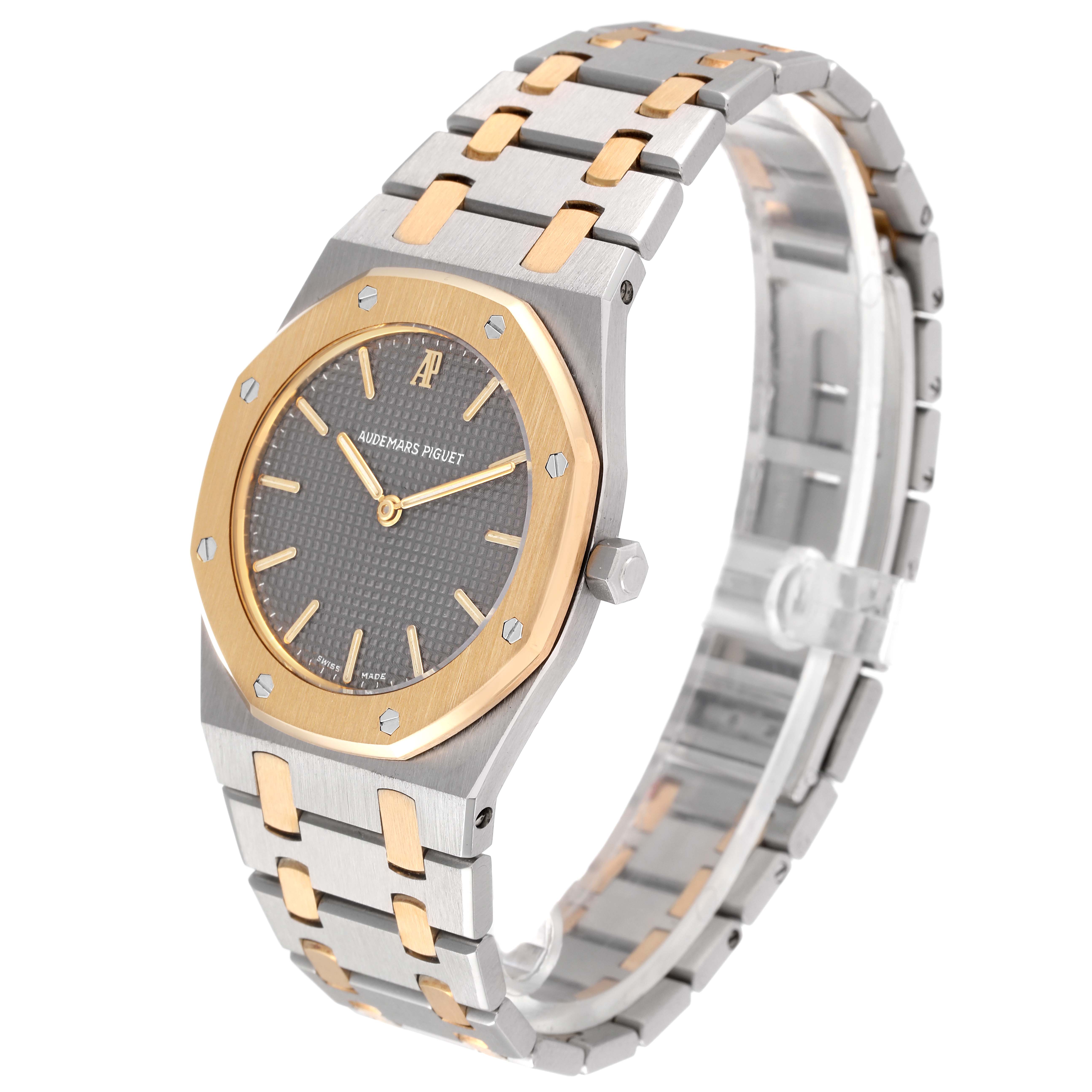 This image shows the Royal Oak watch by Audemars Piguet at an oblique angle, highlighting its dial, bezel, crown, and bracelet.