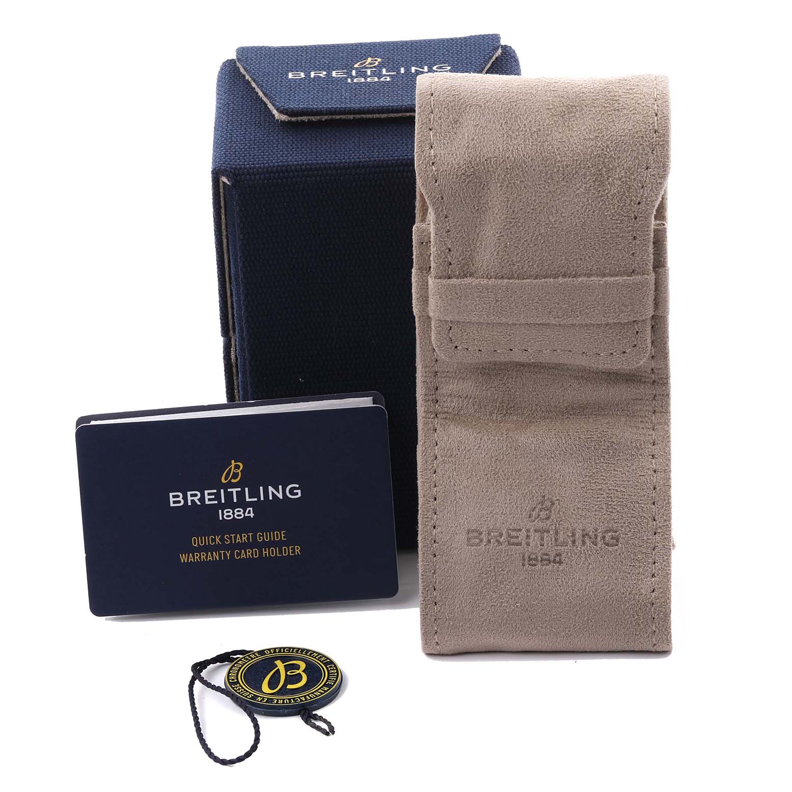 The Breitling Chronomat PB0134 Men's Stainless Steel Blue Dial PB0134 Men's Stainless Steel Blue Dial accessories shown include a case, pouch, warranty card holder, and a logo tag, all viewed from the front.