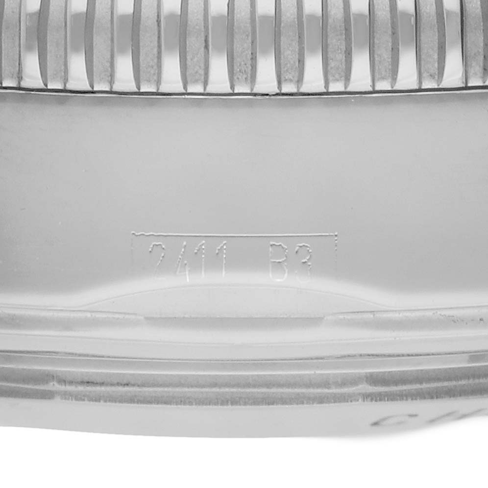 The image shows a close-up of the side and ridged bezel of a Breitling Superocean A13320 Men's Stainless Steel Silver Dial watch with engraved markings.