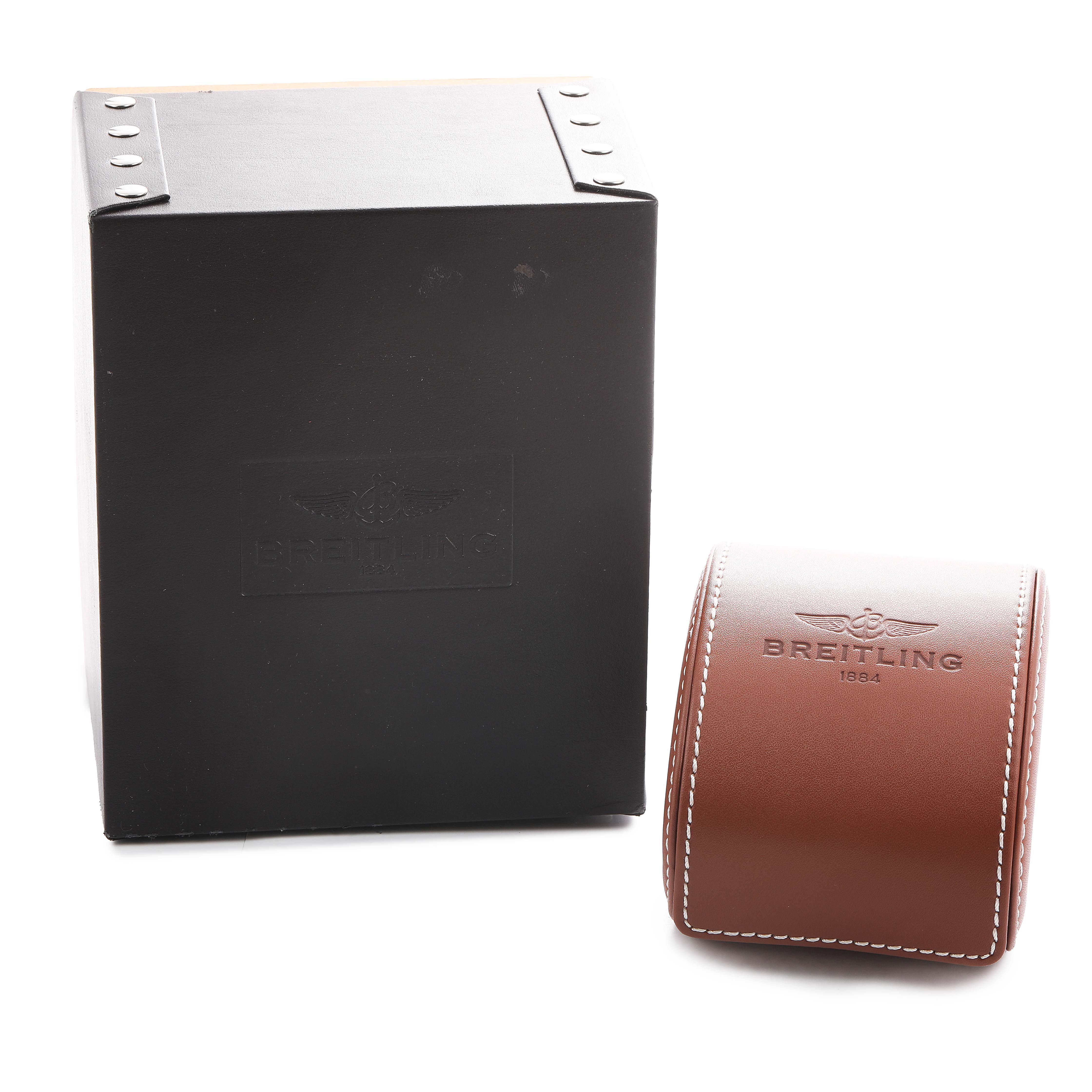 The image shows the packaging for a Breitling Superocean A13320 Men's Stainless Steel Silver Dial watch, featuring a black box and a brown leather case.