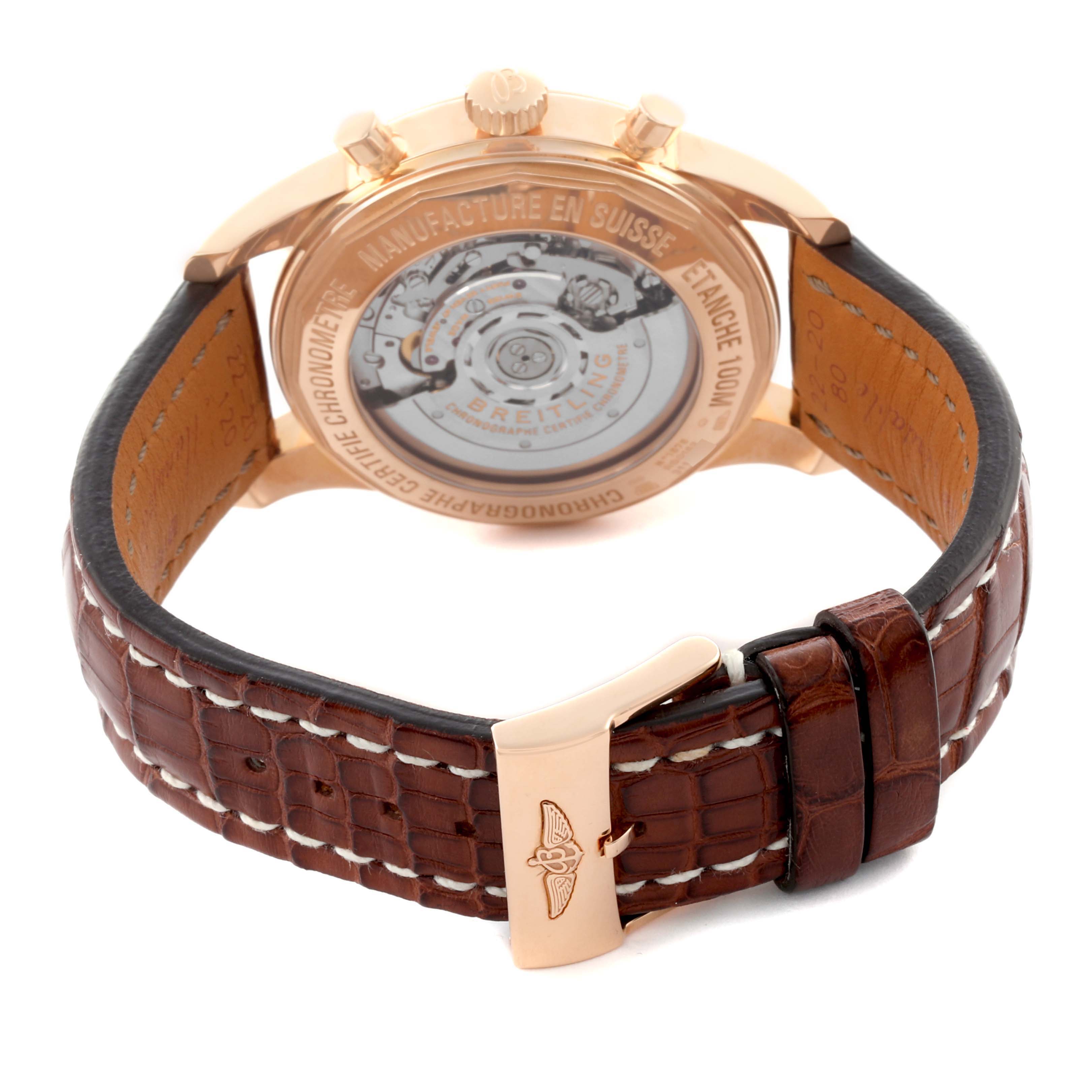 The Breitling Transocean RB0152 Men's Rose Gold Silver Dial RB0152 Men's Rose Gold Silver Dial watch is shown from the back, displaying the movement and leather strap with a buckle.