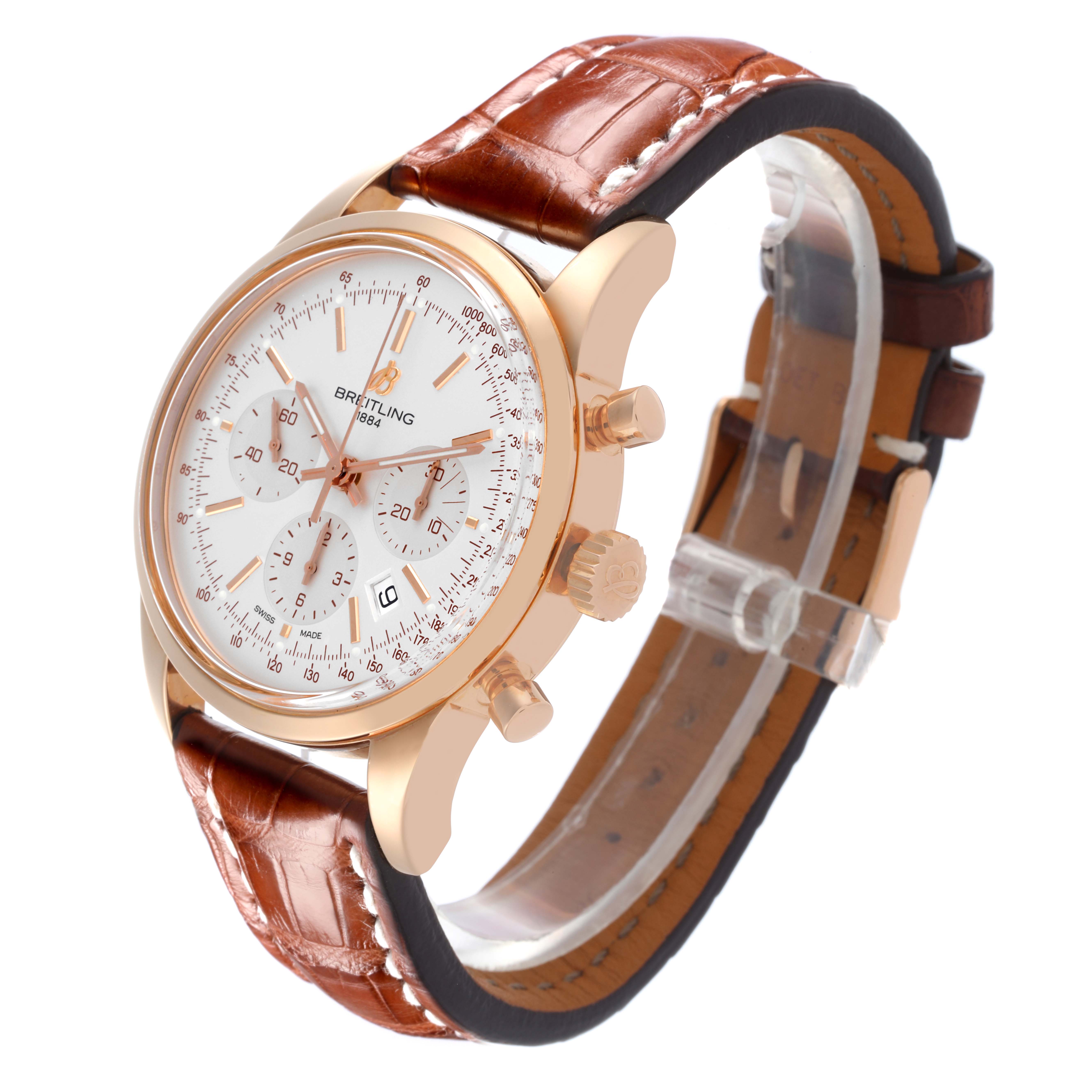 The Breitling Transocean RB0152 Men's Rose Gold Silver Dial RB0152 Men's Rose Gold Silver Dial watch is shown at an angled side view featuring the face, subdials, and partially visible leather strap.