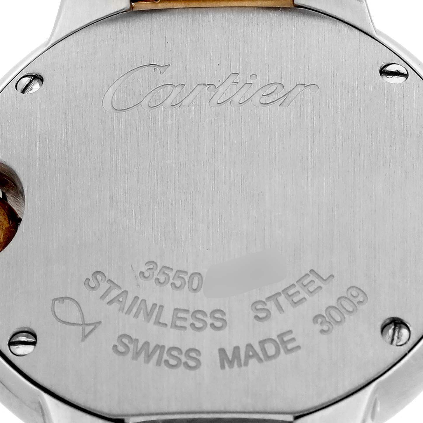 The image shows the back case of a Cartier Ballon Bleu W69007Z3 Women
s Steel and Gold (two tone) Silver Dial W69007Z3 Women
s Steel and Gold (two tone) Silver Dial watch, highlighting the brand engraving and material details.