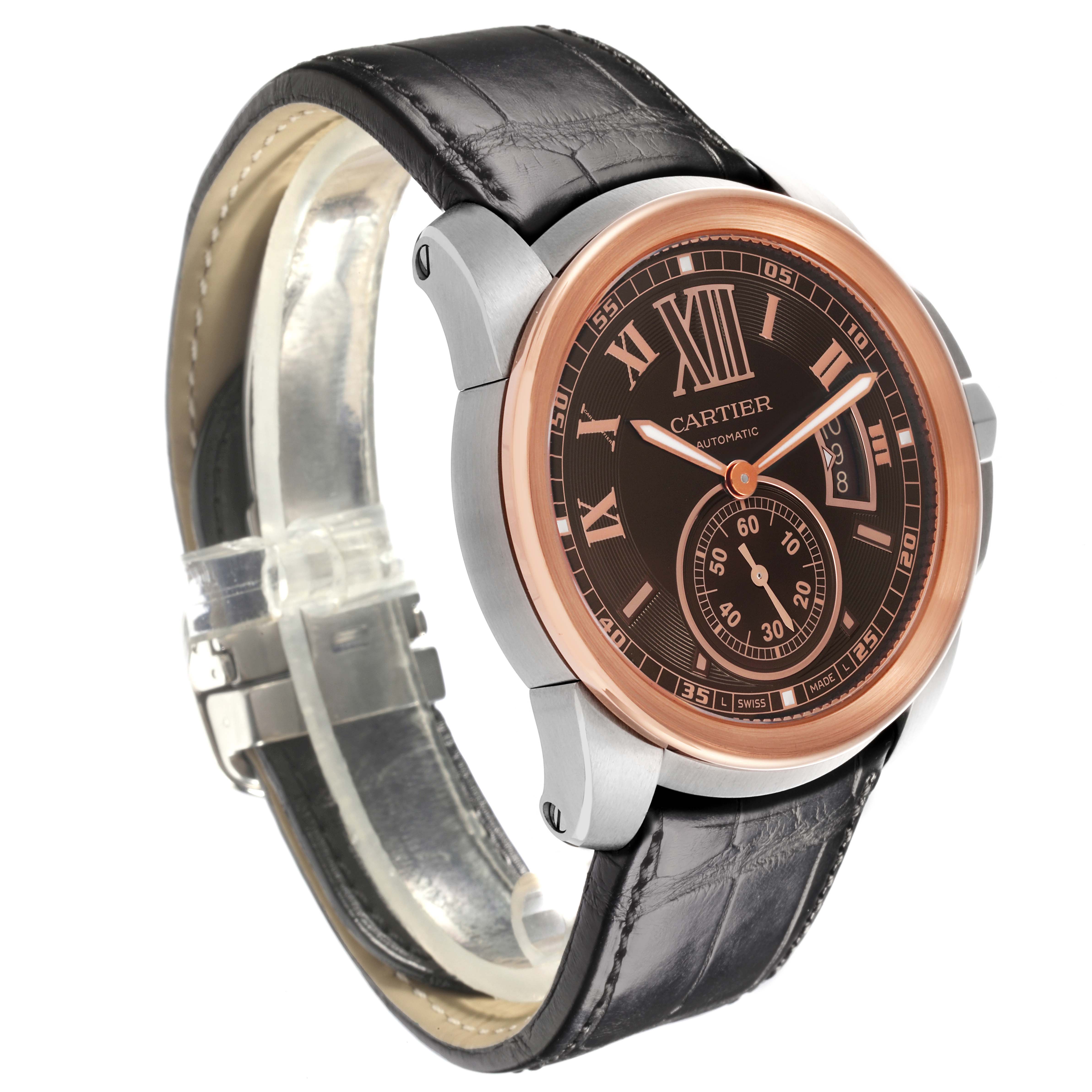 The Calibre de Cartier watch is shown at a slight side angle, highlighting the face, case, and leather strap.