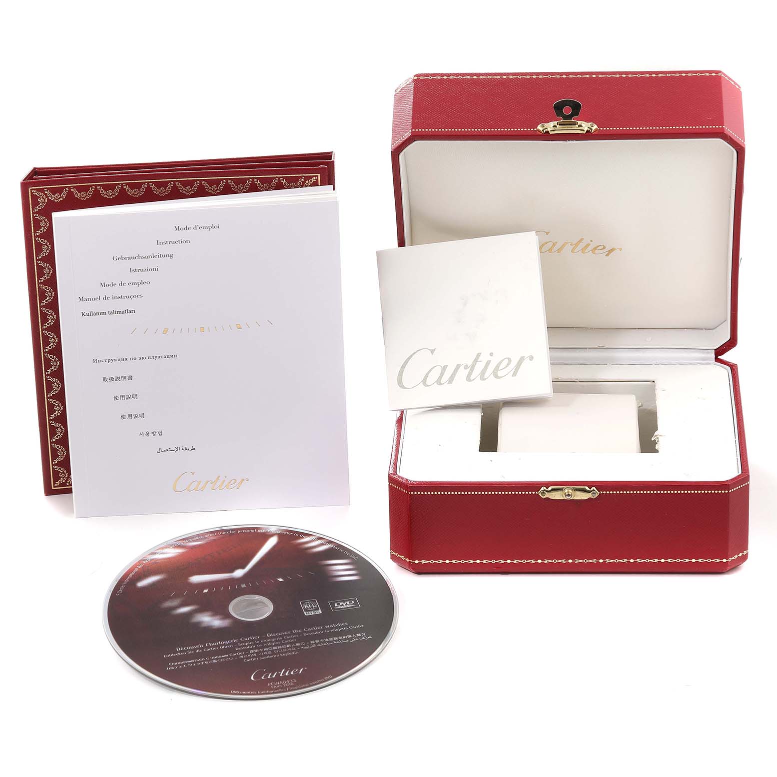 This image shows the packaging and accessories for the Cartier Tank Americaine W2603156 Men's Yellow Gold Silver Dial W2603156 Men's Yellow Gold Silver Dial watch, including the box, manual, and a CD.