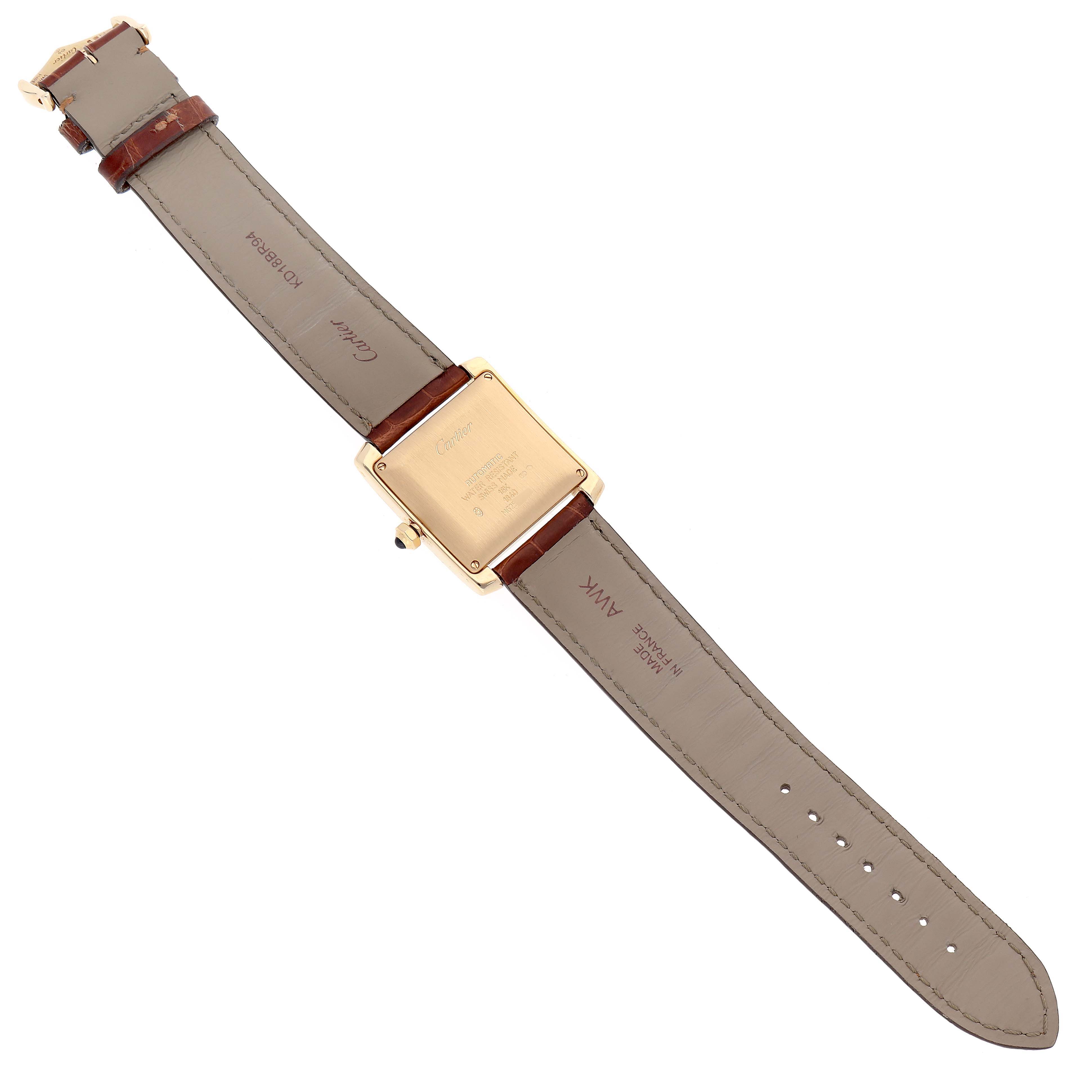 The image shows the back view of a Cartier Tank Française watch, displaying its leather strap and case back.