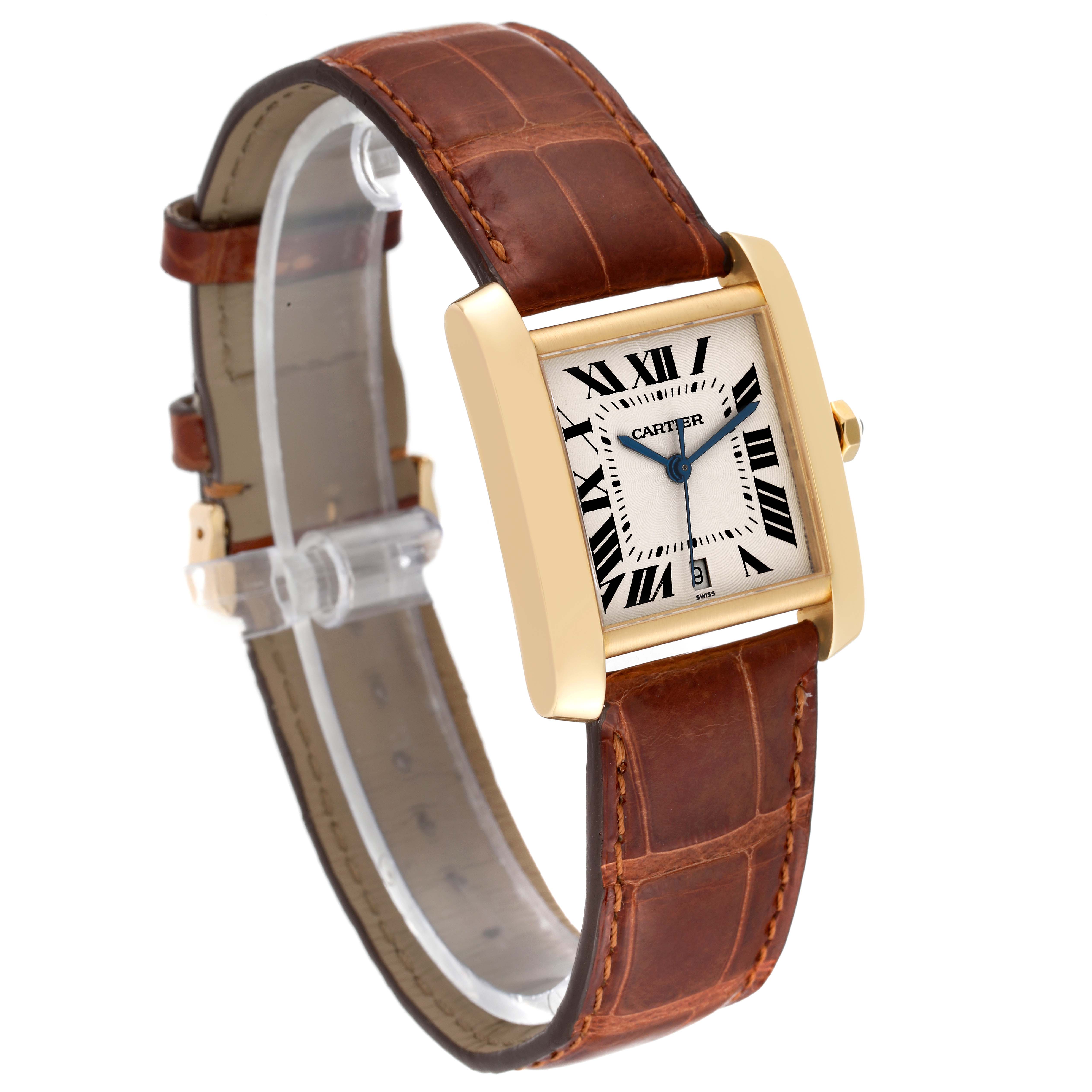 The image shows a Cartier Tank Francaise W5000156 Men
s Yellow Gold Silver Dial W5000156 Men
s Yellow Gold Silver Dial watch at a three-quarter angle, highlighting its gold rectangular case, roman numeral dial, and brown leather strap.