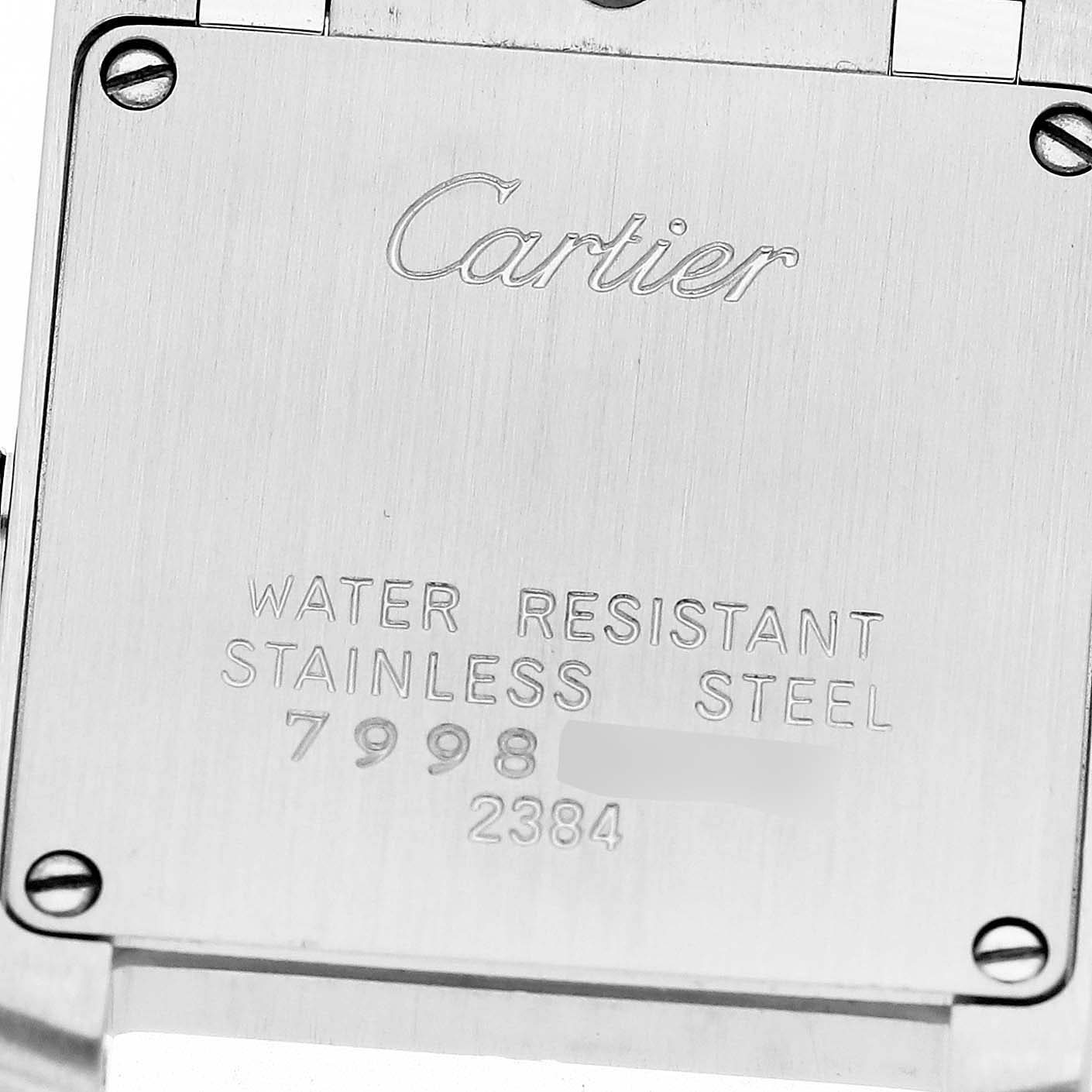 The image shows the back case of a Cartier Tank Francaise W51008Q3 Women
s Stainless Steel Silver Dial W51008Q3 Women
s Stainless Steel Silver Dial watch, highlighting its water resistance and serial number.