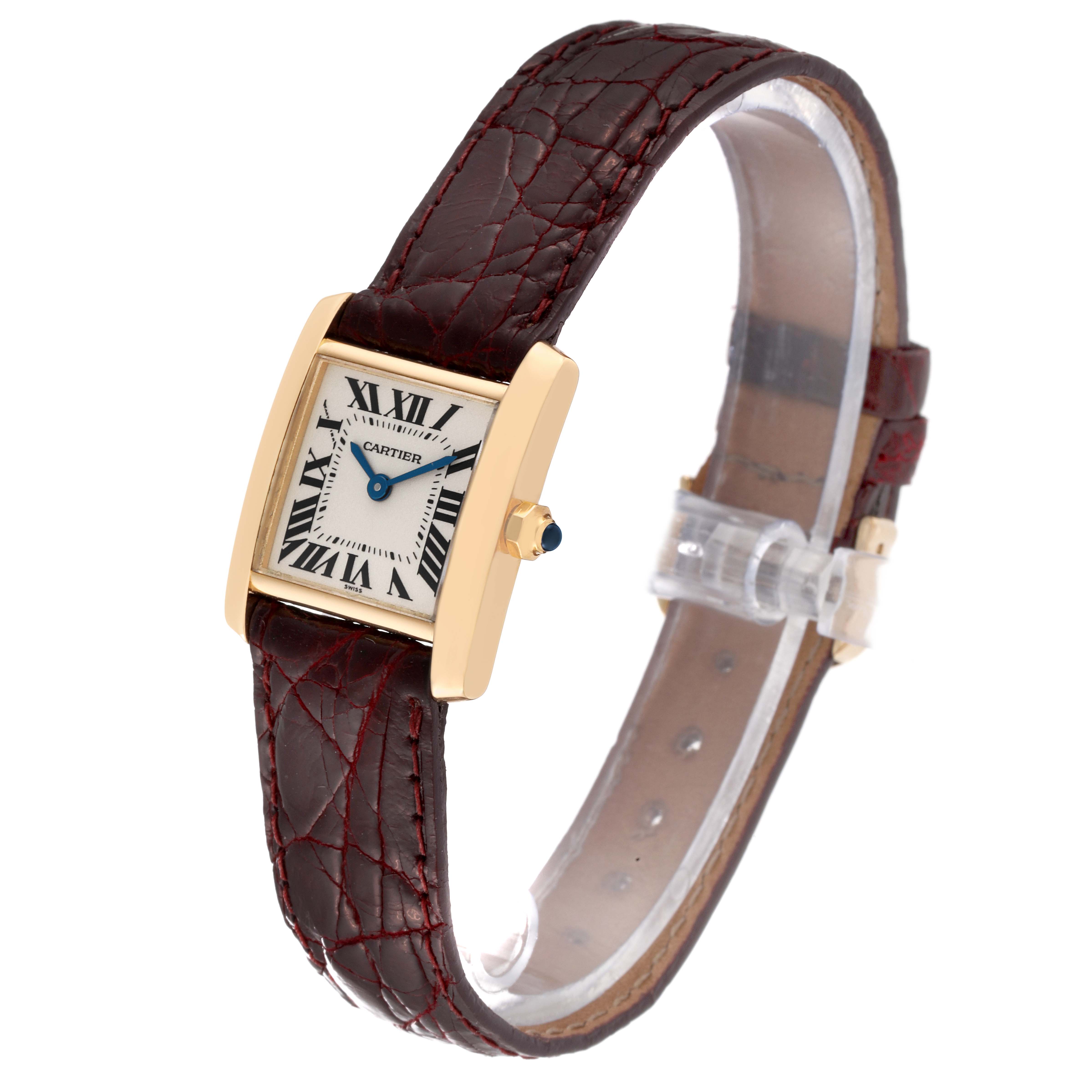 This Cartier Tank Française watch is shown at a three-quarter angle, highlighting its rectangular face and leather strap.