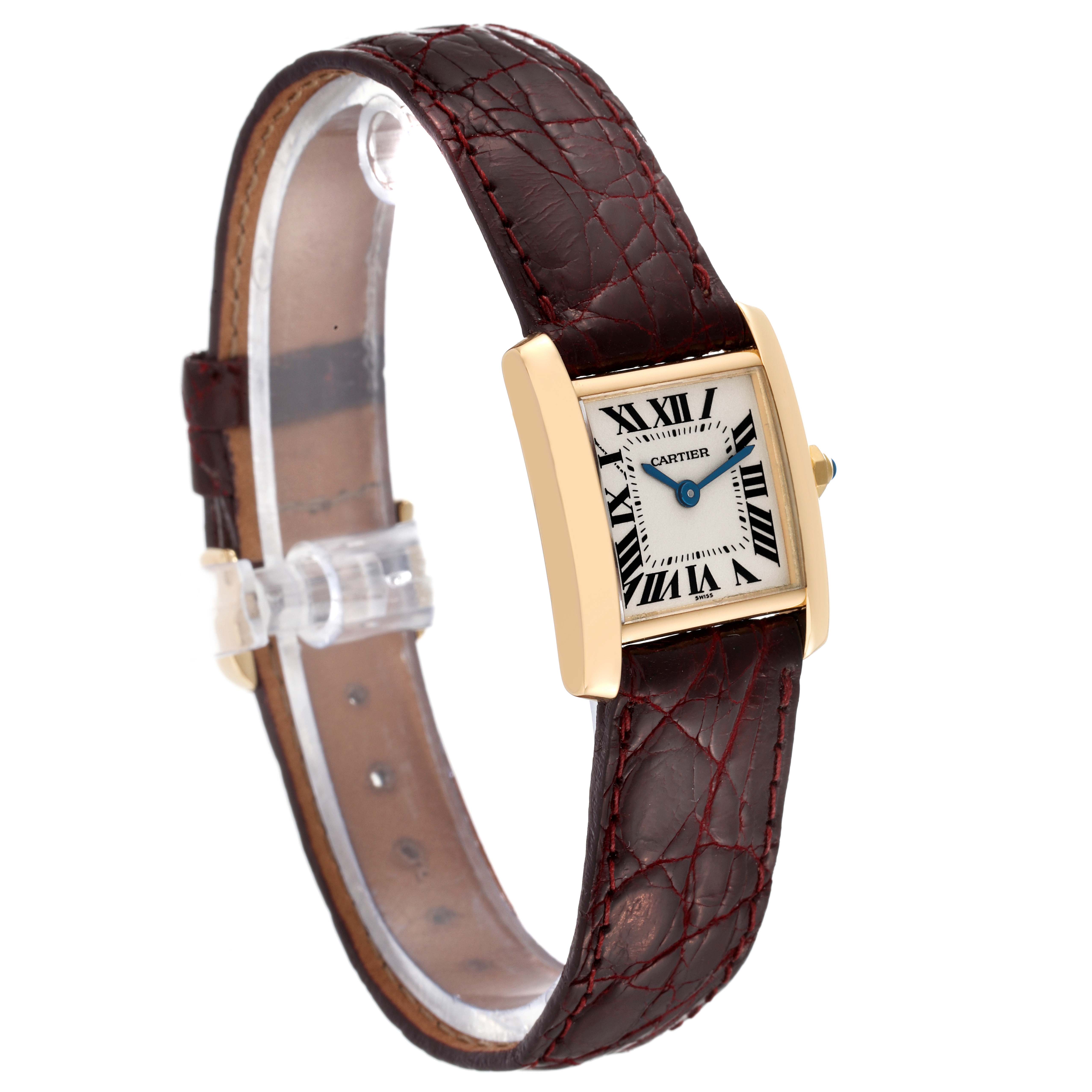 The Cartier Tank Francaise W5000256 Women
s Yellow Gold Silver Dial W5000256 Women
s Yellow Gold Silver Dial watch is shown at a three-quarter angle, highlighting its rectangular dial, gold case, and leather strap.