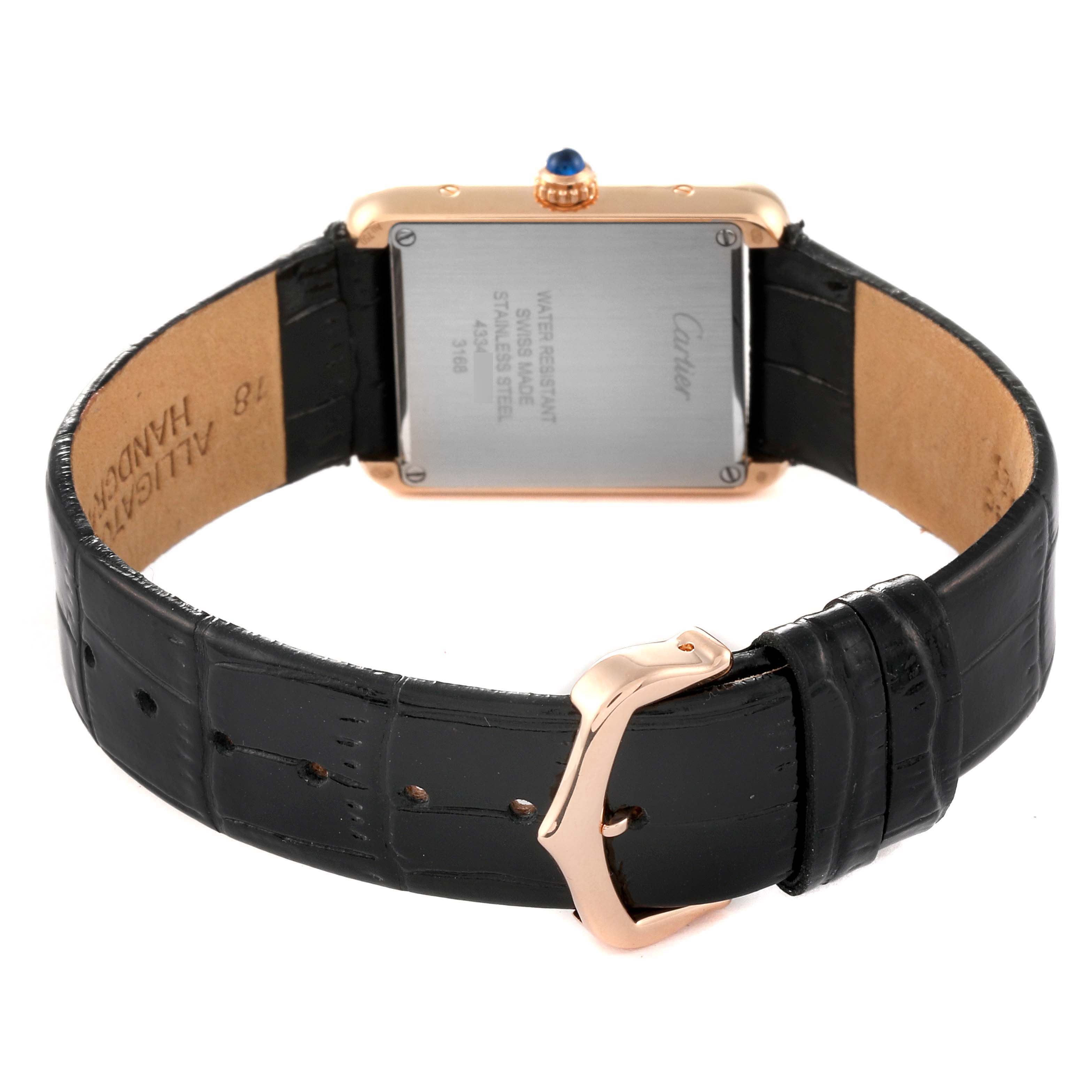 The image shows the back side of the Cartier Tank Solo W5200024 Women
s Steel and Gold (two tone) Silver Dial W5200024 Women
s Steel and Gold (two tone) Silver Dial watch, including the clasp and black leather strap.