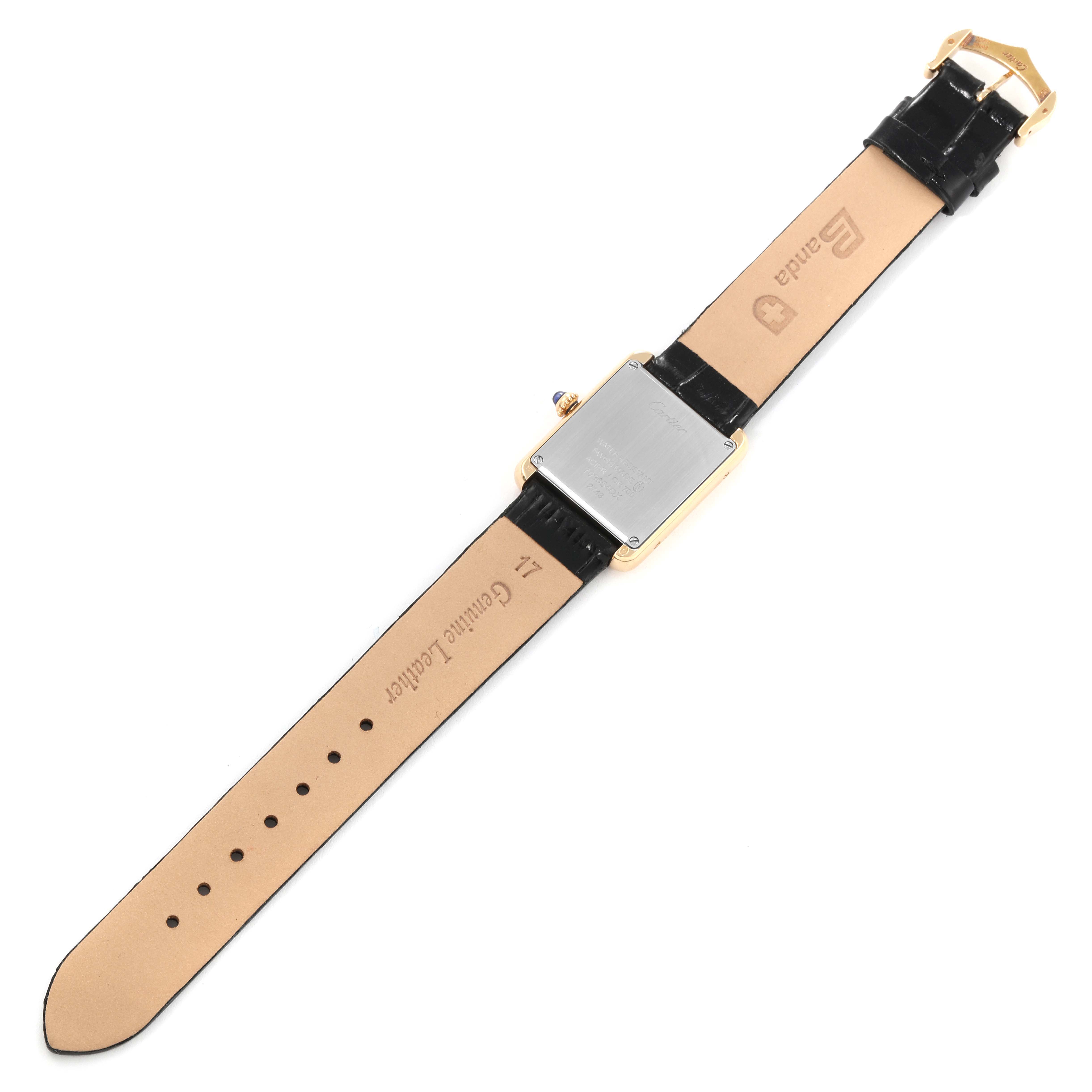 The image shows the back view of a Cartier Tank Solo W1018755 Women
s Steel and Gold (two tone) Silver Dial W1018755 Women
s Steel and Gold (two tone) Silver Dial watch, highlighting the case back and leather strap with the buckle visible.