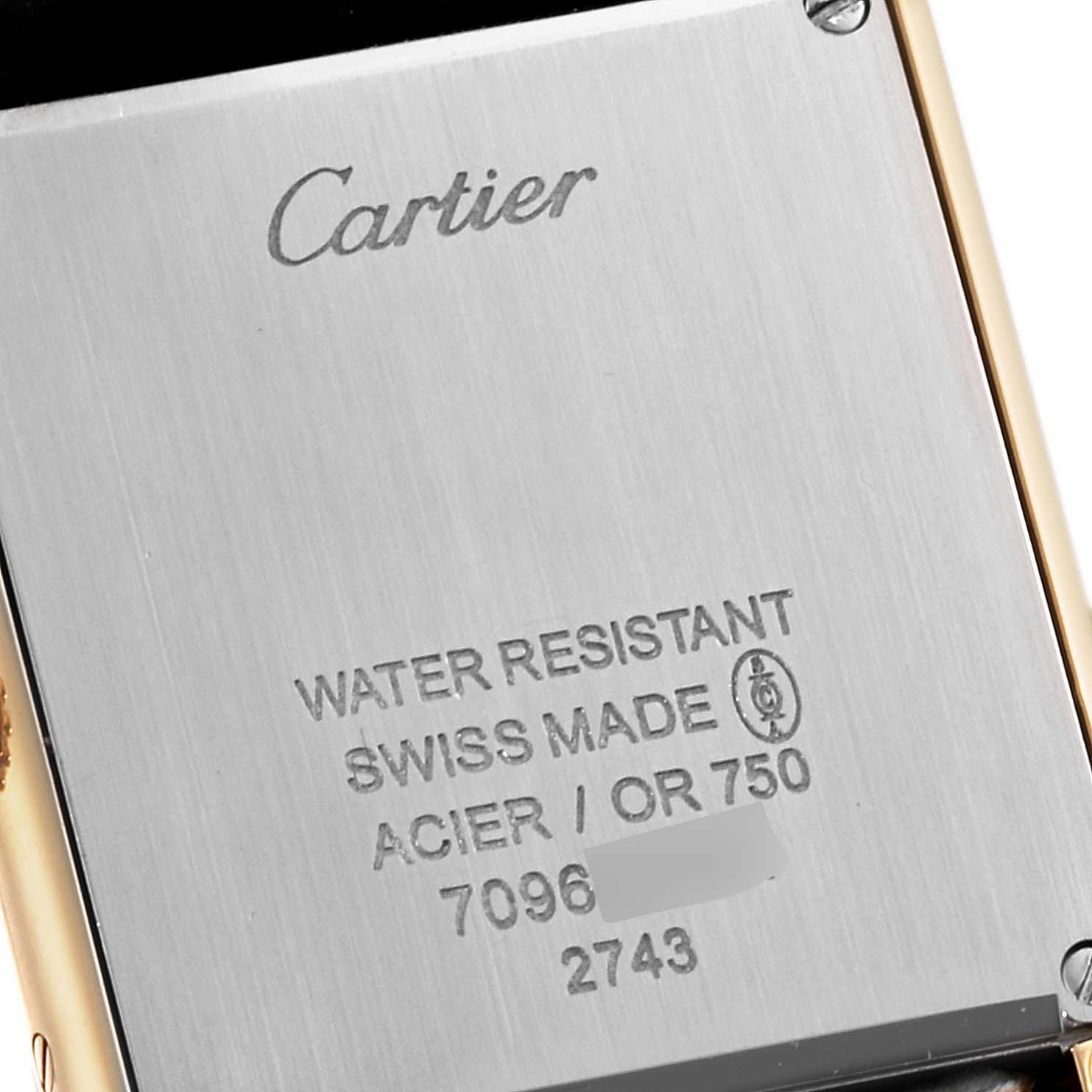 This image shows the back case of the Cartier Tank Solo W1018755 Women
s Steel and Gold (two tone) Silver Dial W1018755 Women
s Steel and Gold (two tone) Silver Dial watch, highlighting the brand name, water resistance, and Swiss Made details.