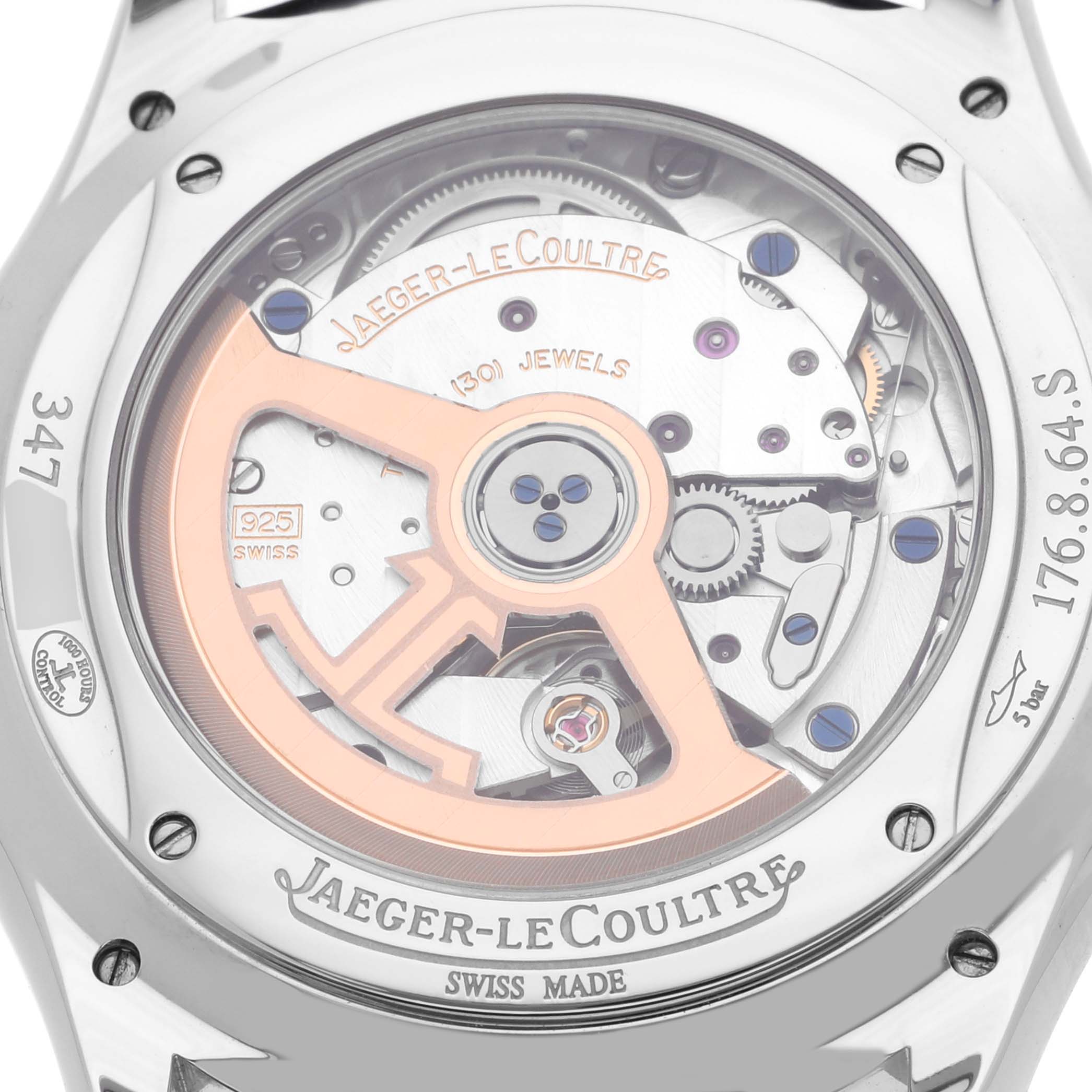 The image shows the back view of a Jaeger-LeCoultre Master watch, displaying its mechanical movement and rotor.