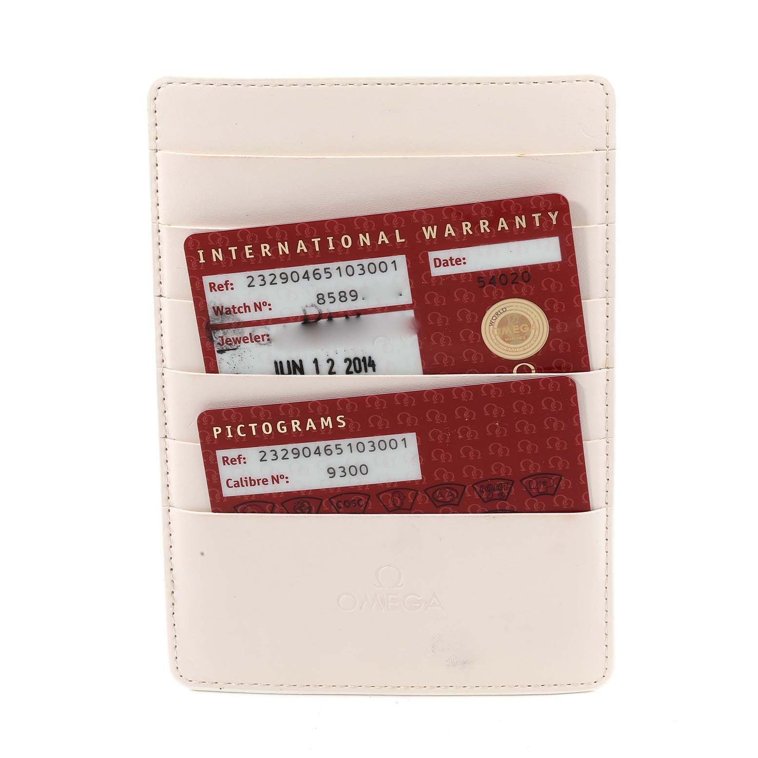 This image shows the warranty cards within an Omega cardholder for the Planet Ocean model watch.