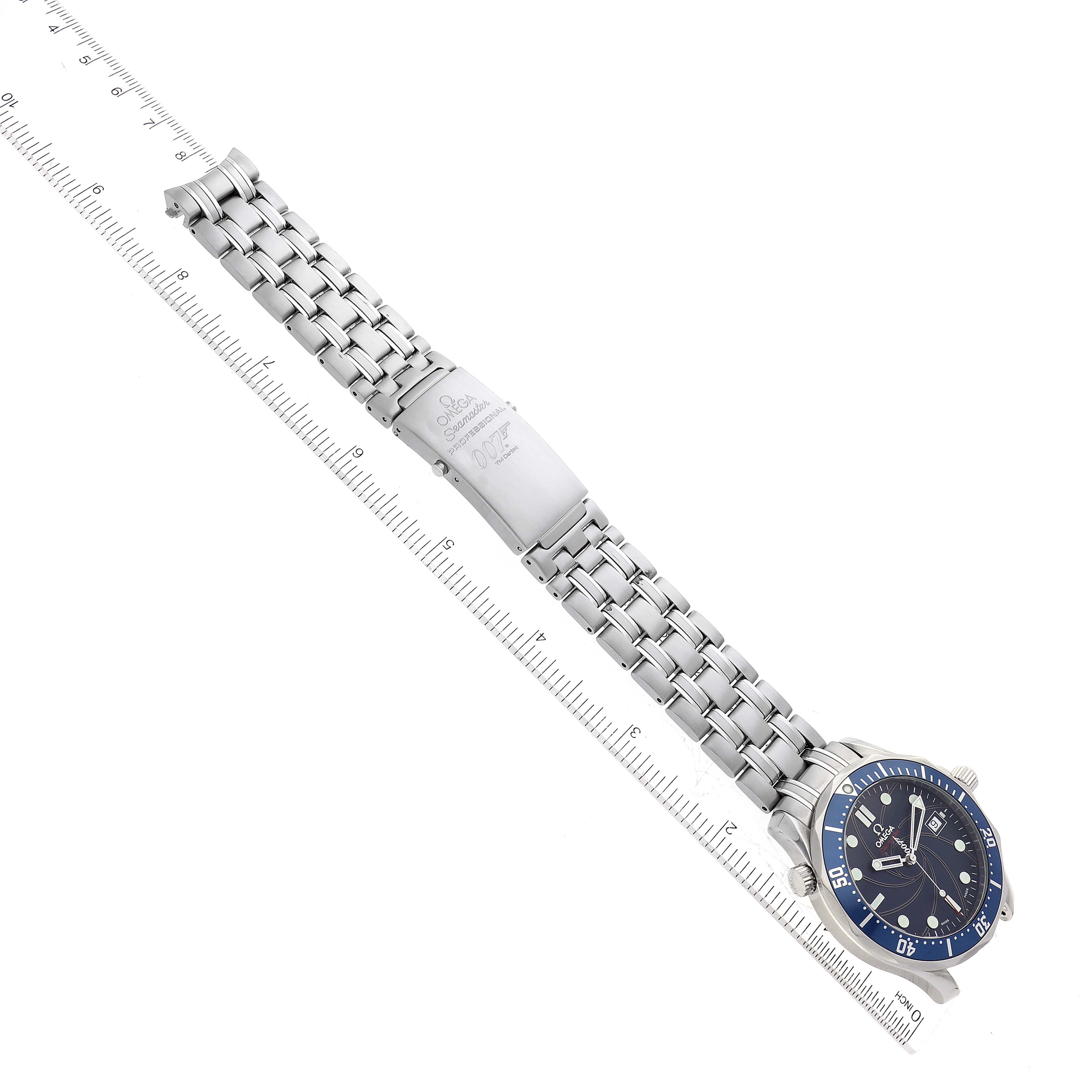 The image shows an Omega Seamaster 2226.80.00 Men's Stainless Steel Blue Dial 2226.80.00 Men's Stainless Steel Blue Dial watch placed diagonally, highlighting the full length of its metal bracelet and clasp against a ruler.