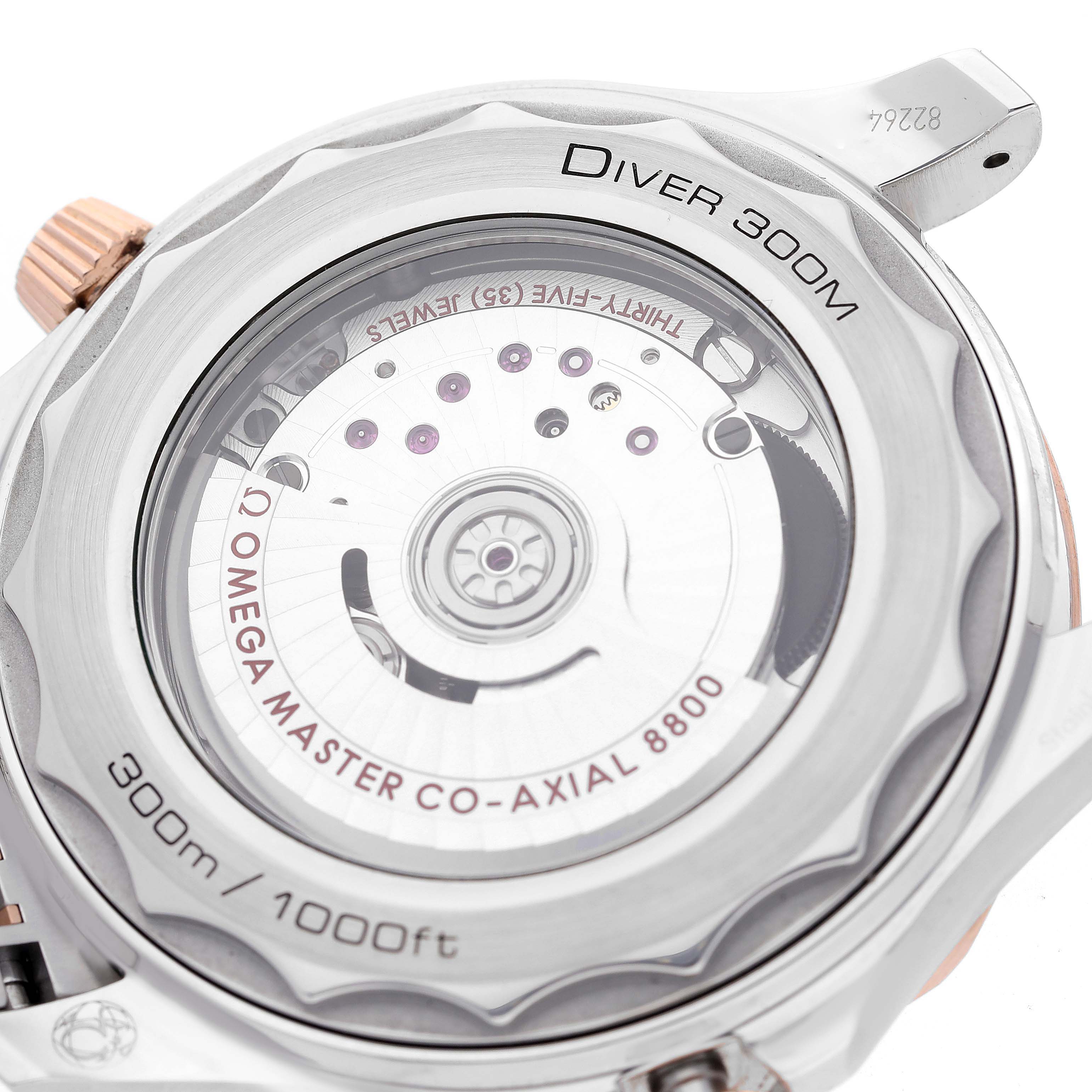 The image shows the back view of the Omega Seamaster 210.20.42.20.03.002 Men's Steel and Gold (two tone) Blue Dial 210.20.42.20.03.002 Men's Steel and Gold (two tone) Blue Dial Diver 300M, highlighting the movement through the transparent case back.