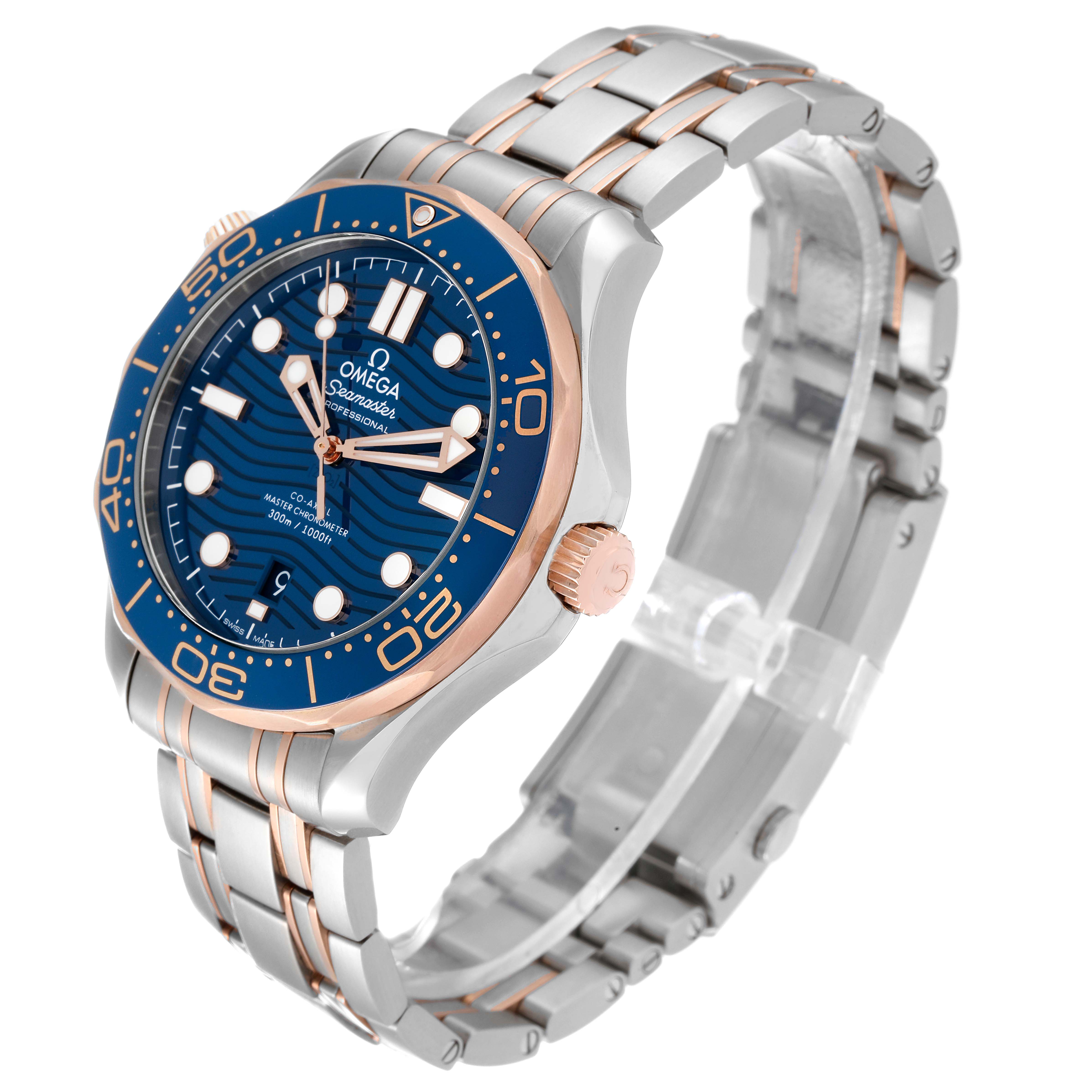 The image shows an Omega Seamaster 210.20.42.20.03.002 Men's Steel and Gold (two tone) Blue Dial 210.20.42.20.03.002 Men's Steel and Gold (two tone) Blue Dial watch at an angle highlighting its face, crown, and stainless steel bracelet with rose gold accents.