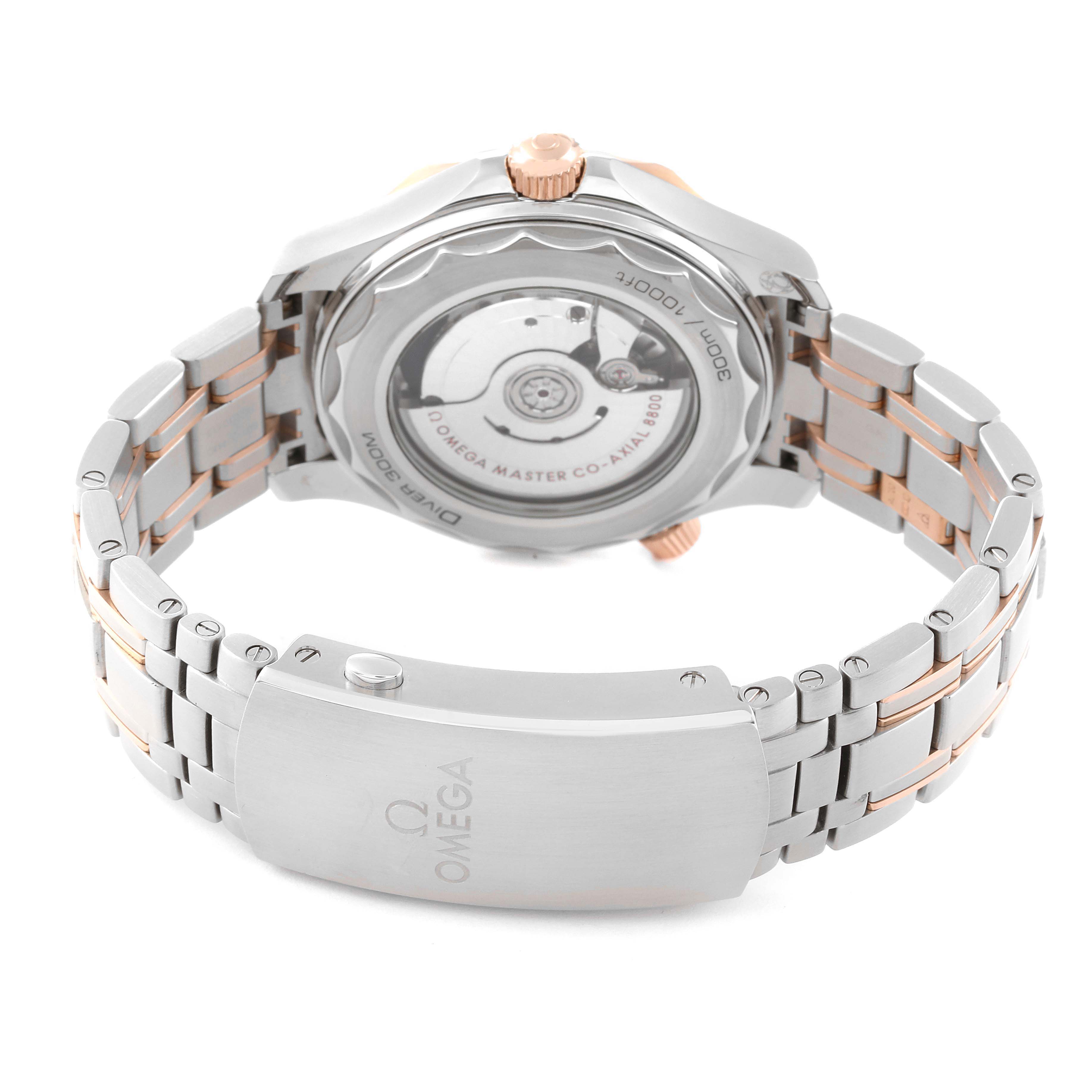 The image shows the back view of an Omega Seamaster 210.20.42.20.03.002 Men's Steel and Gold (two tone) Blue Dial 210.20.42.20.03.002 Men's Steel and Gold (two tone) Blue Dial watch, highlighting its open case back and metal bracelet.